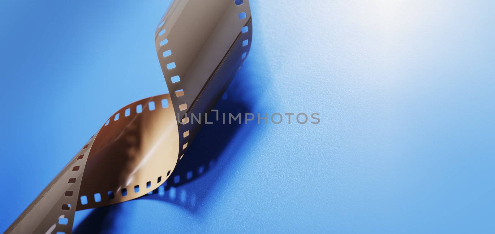 35mm Film on blue background with copy space.