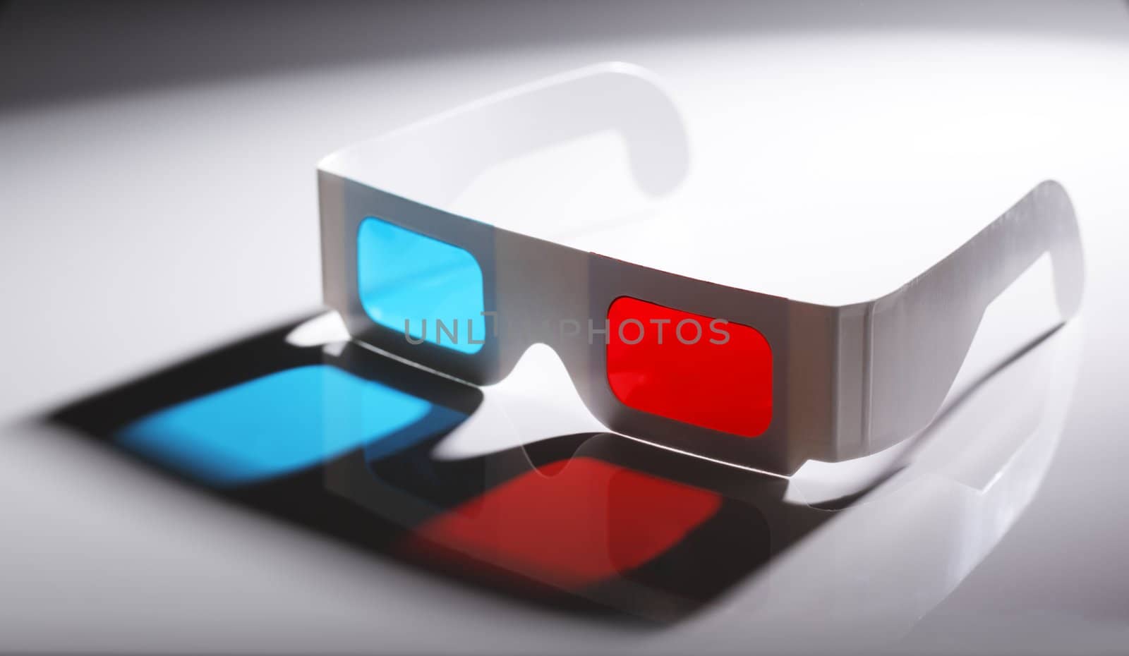 Disposable cardboard 3D Anaglyph glasses with cyan/red lenses.