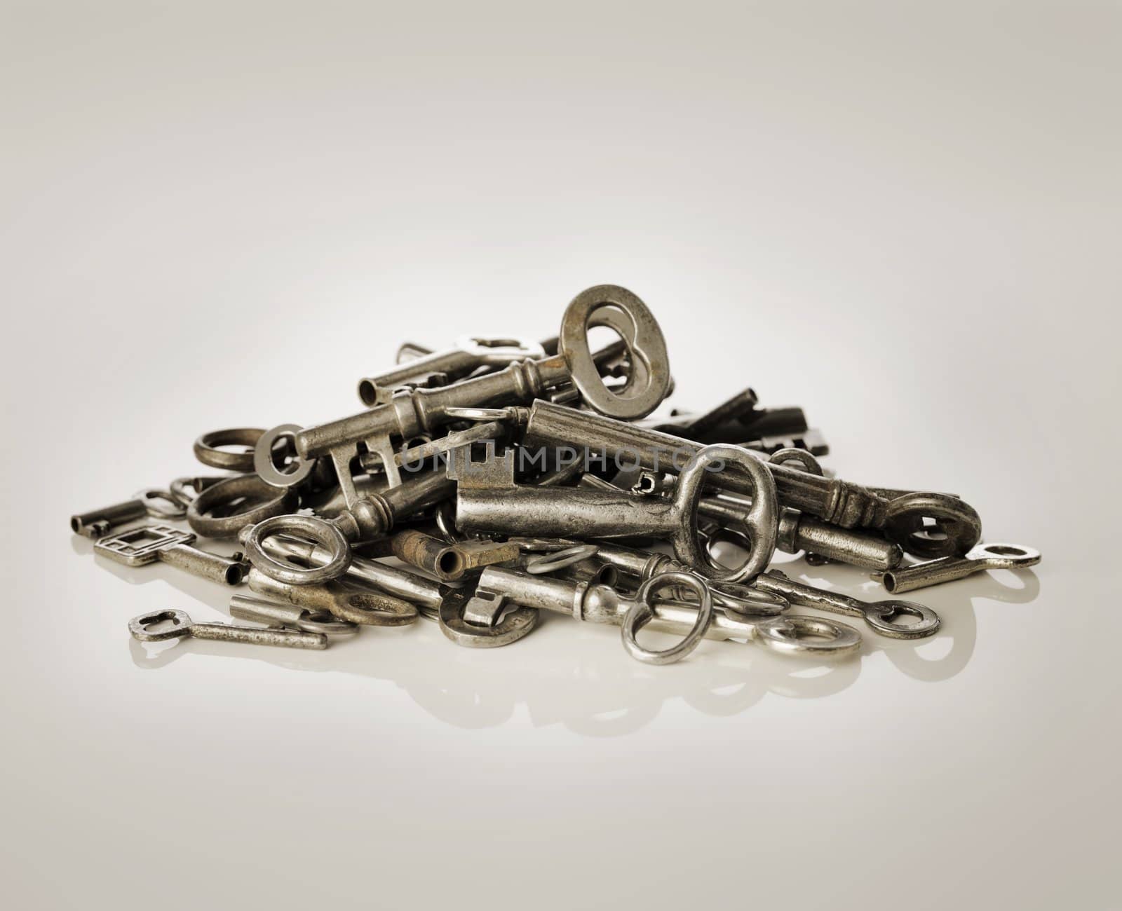 A Pile of old metallic keys.
