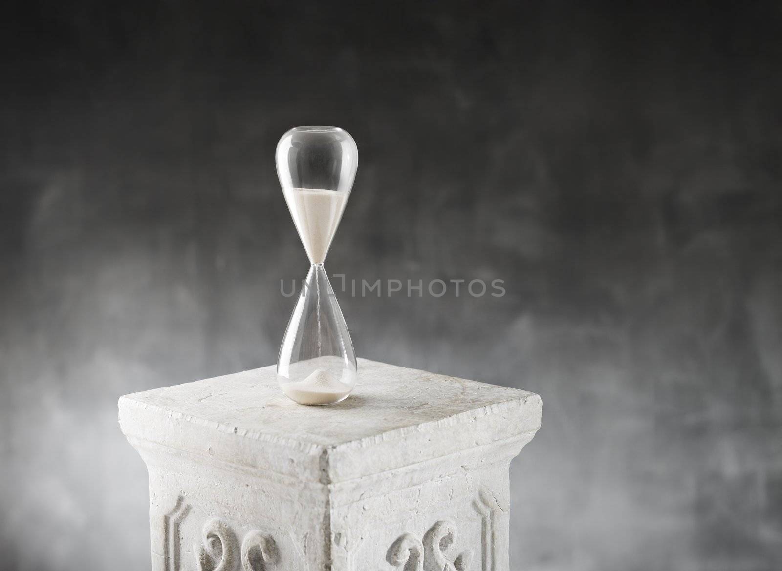 Hourglass on a plaster column.