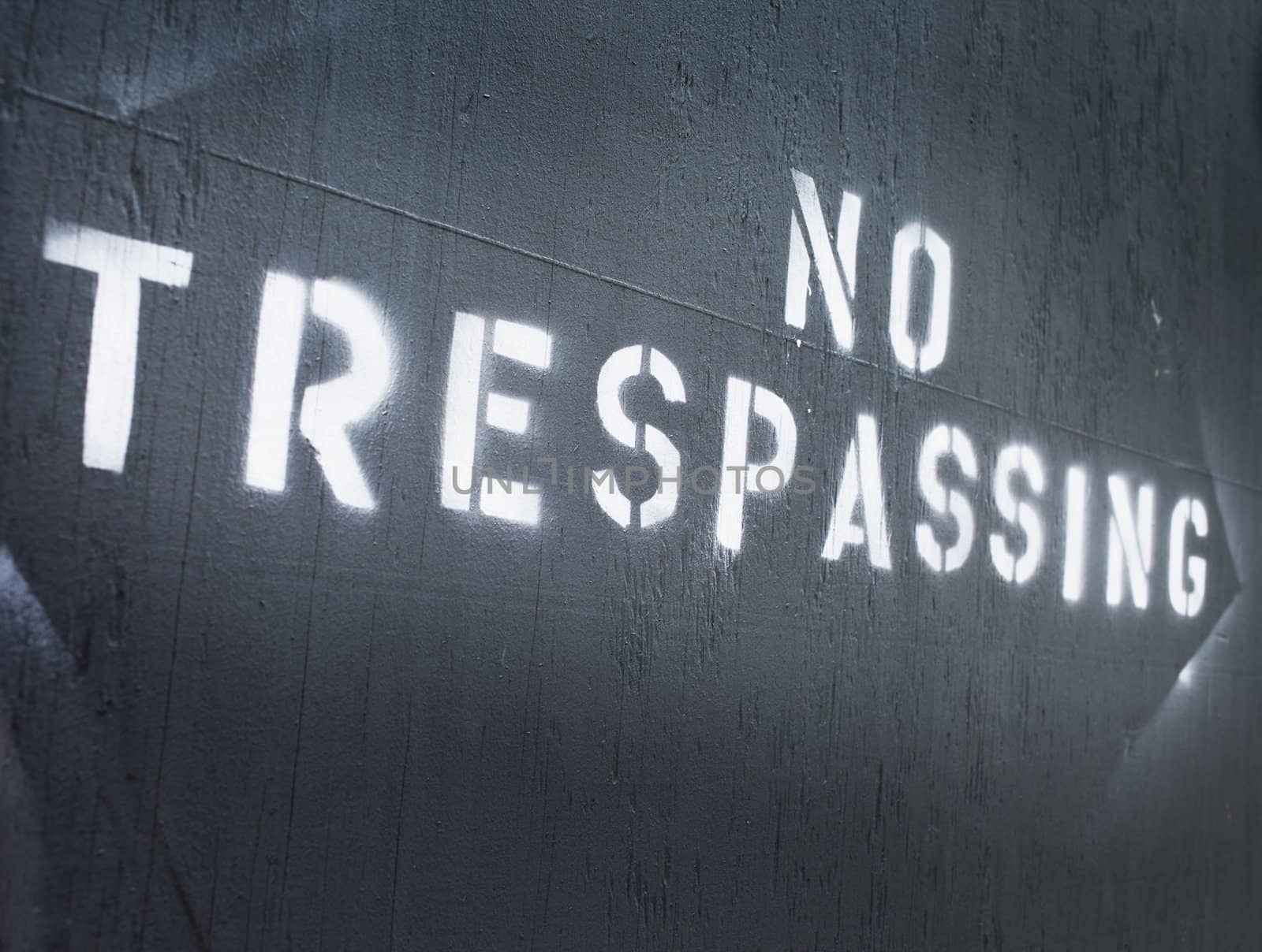 Text "No Trespassing" sprayed on a wall.