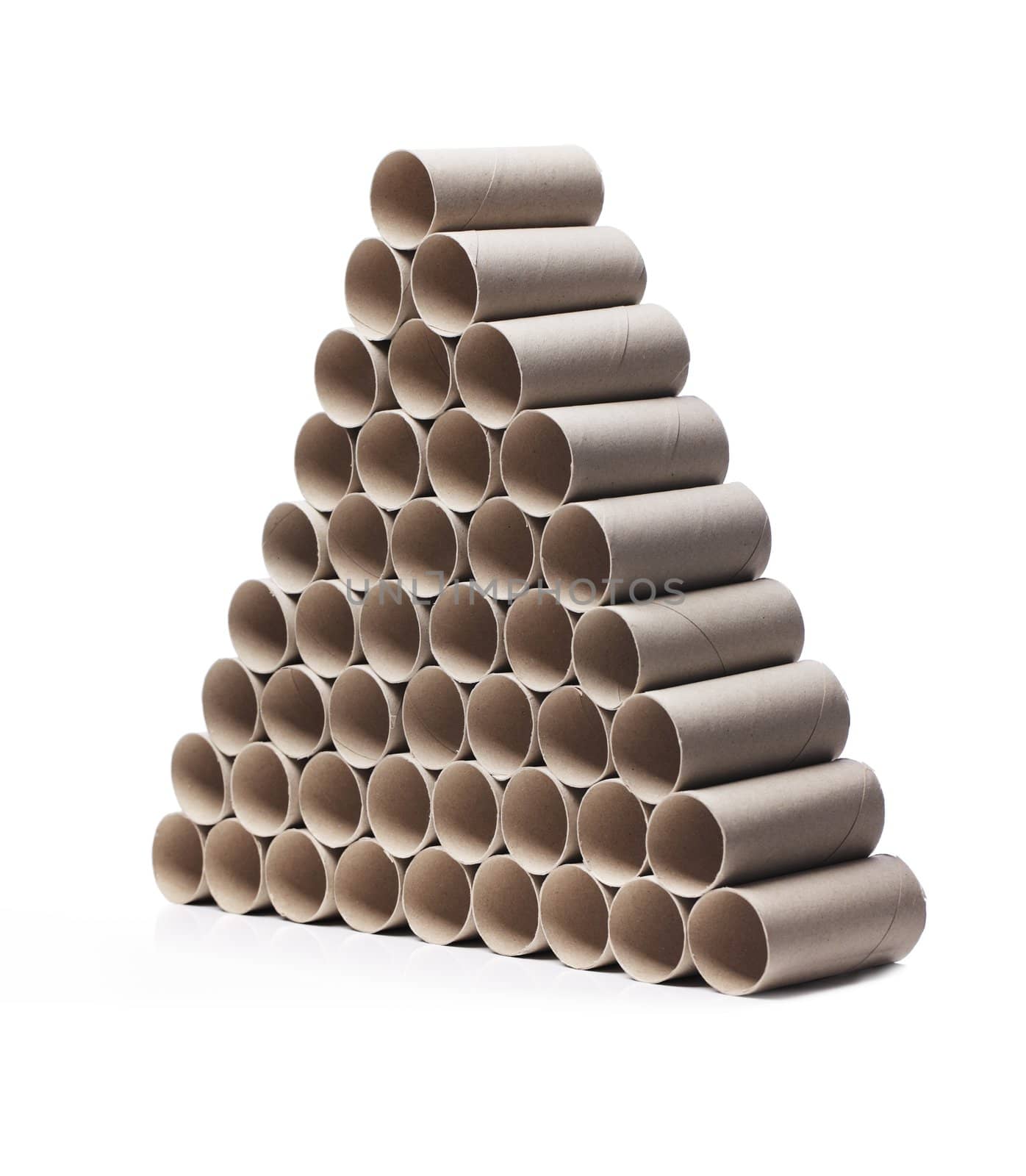 Used toilet paper cardboard rolls stacked in a triangular fashion.