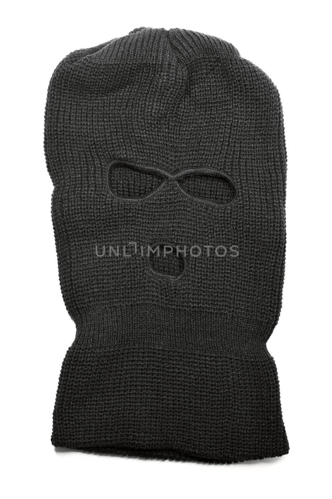 A Black ski mask aka Balaclava isolated on white with natural shadows.