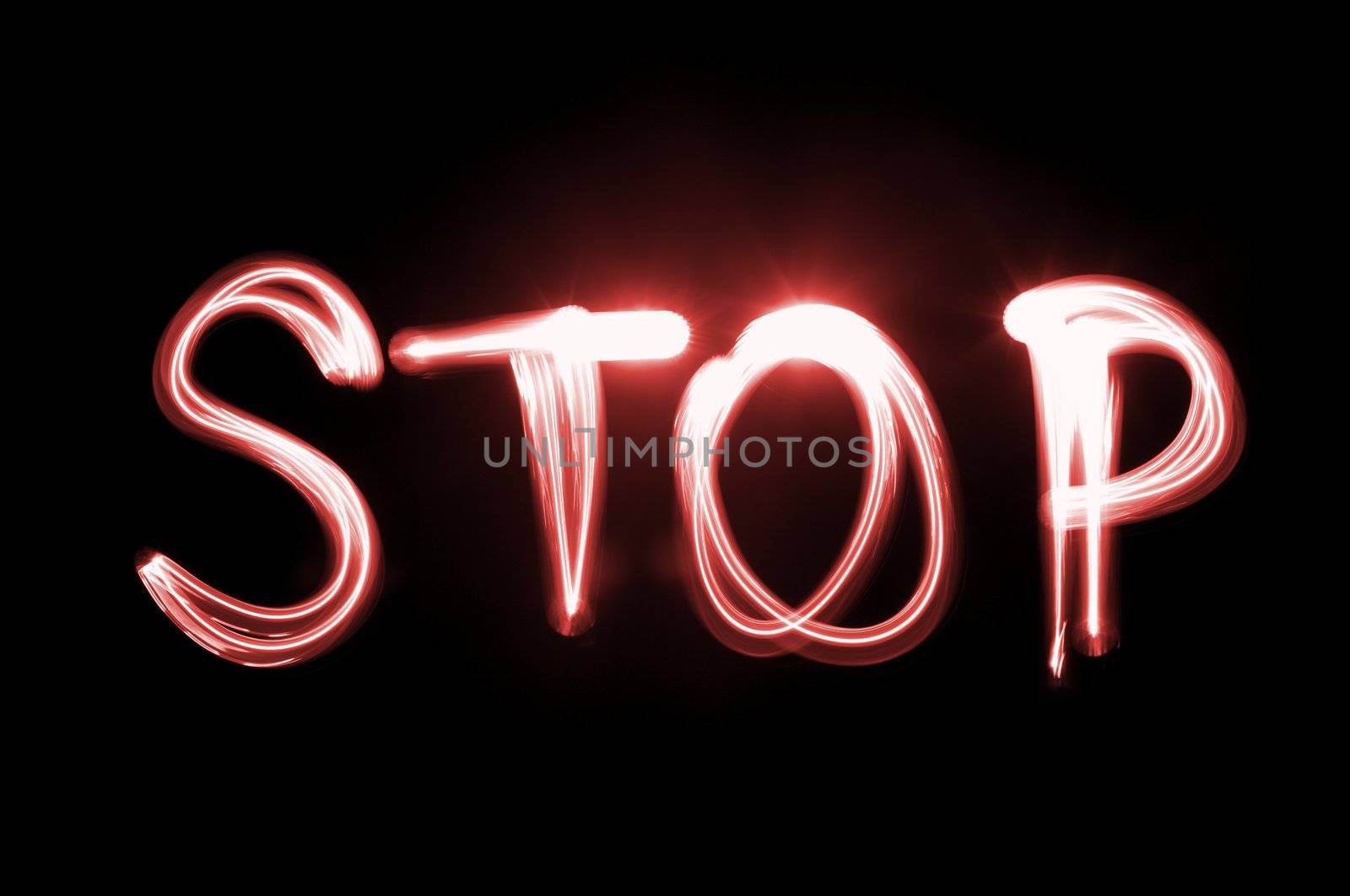 Word STOP written with flashlight