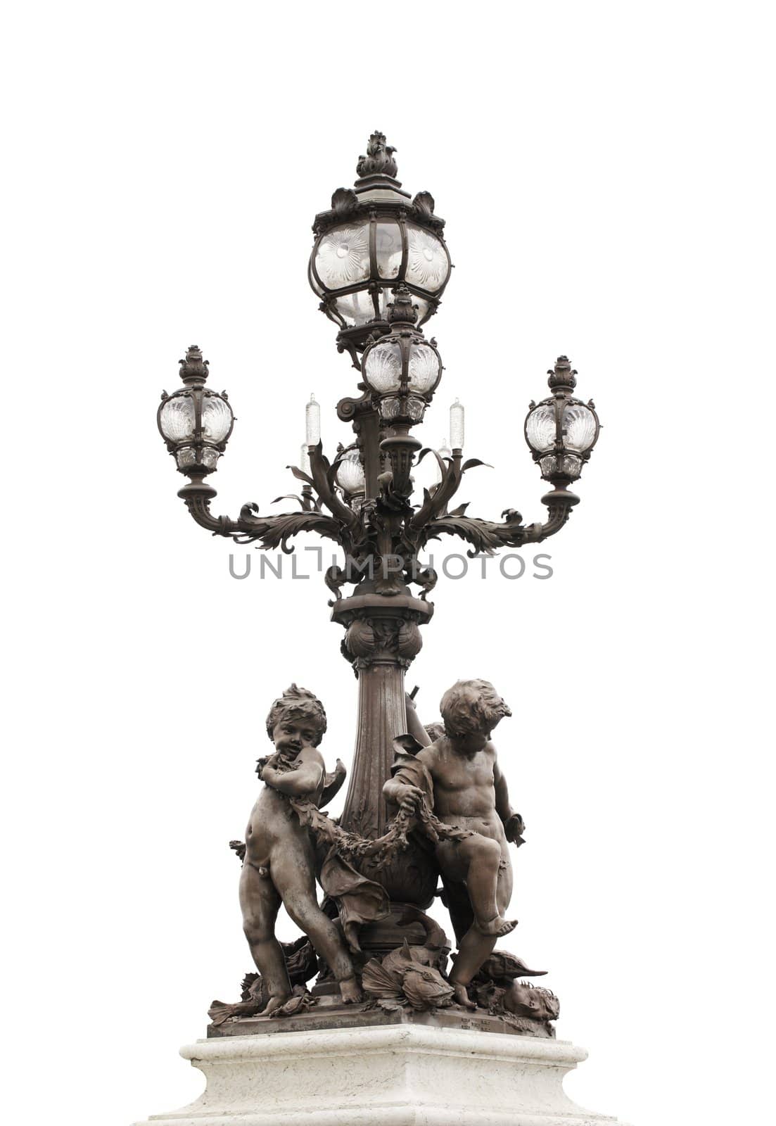 Ornate lamp post of Pont Alexandre III bridge in Paris, France.