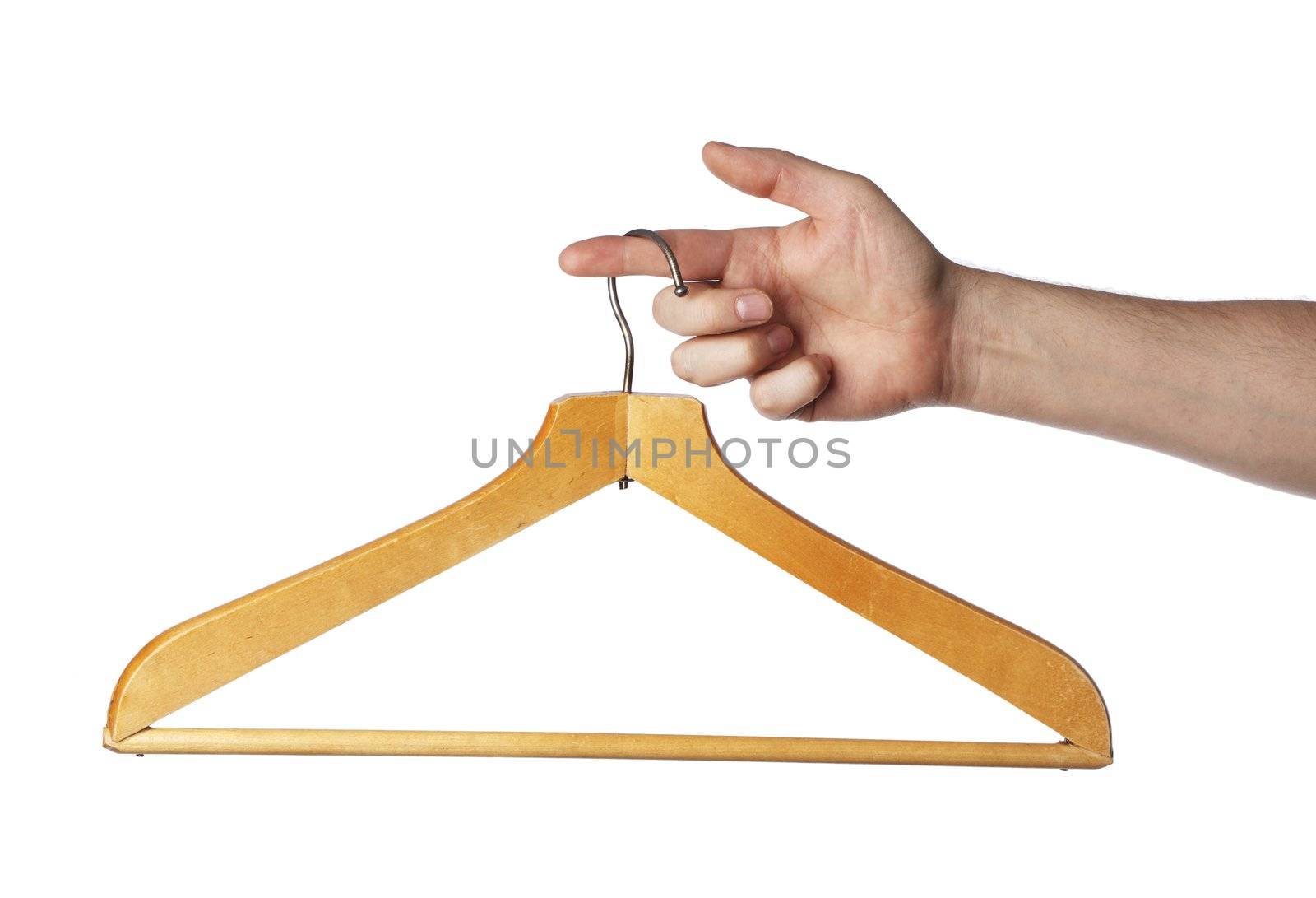 Old wooden clothes hanger hanging from a finger