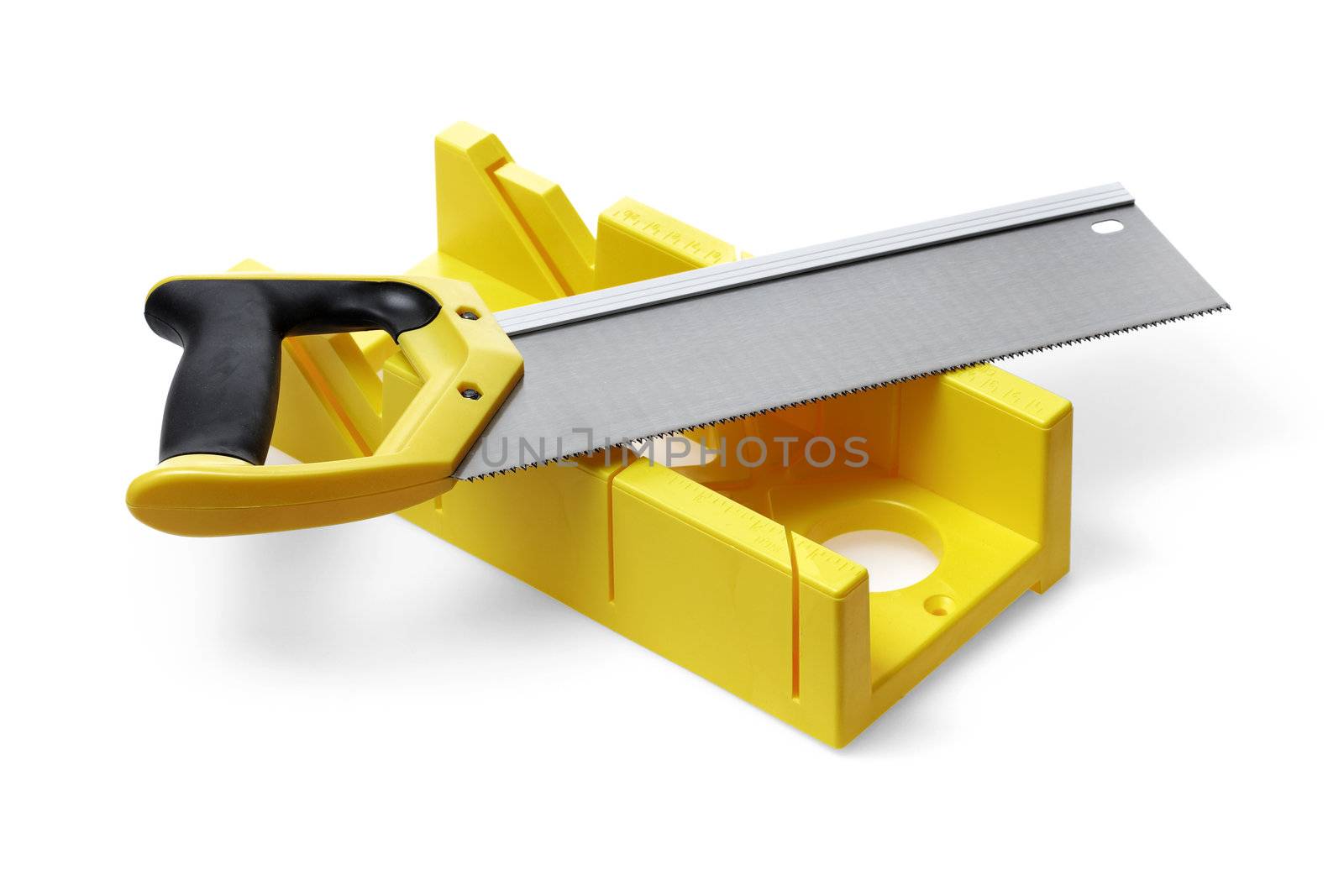 A yellow miter box and a backsaw on white