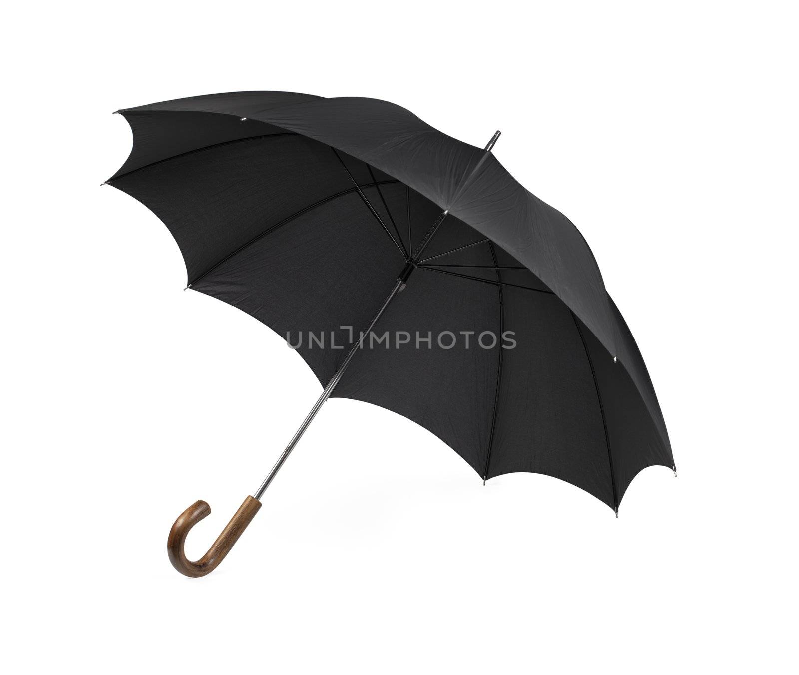 Black vintage umbrella isolated on white with some natural shadows.