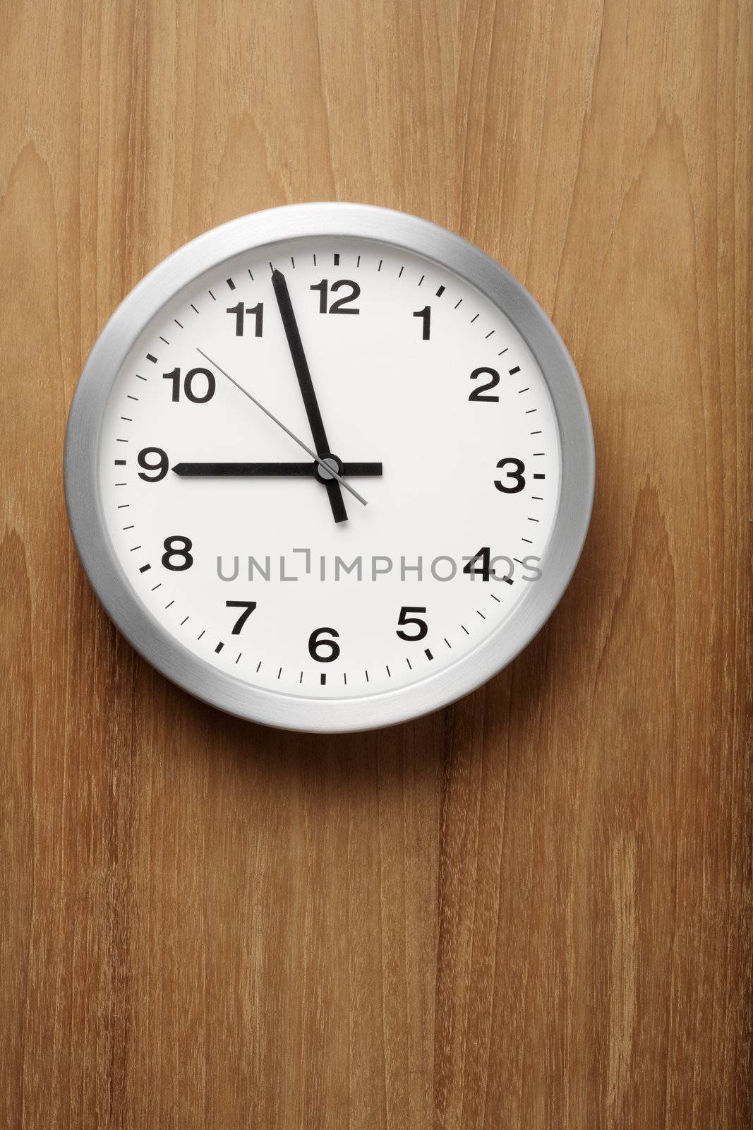 The aluminum wall clock is almost nine