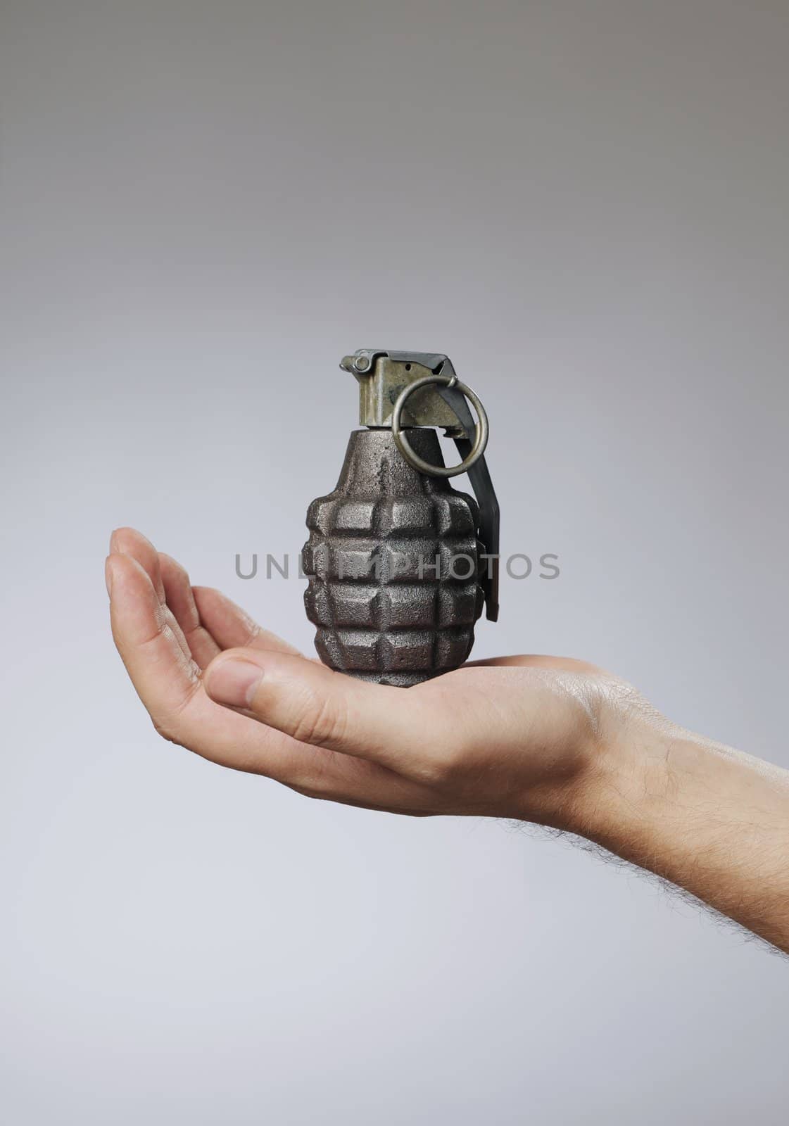 Man holding a hand grenade in his hand