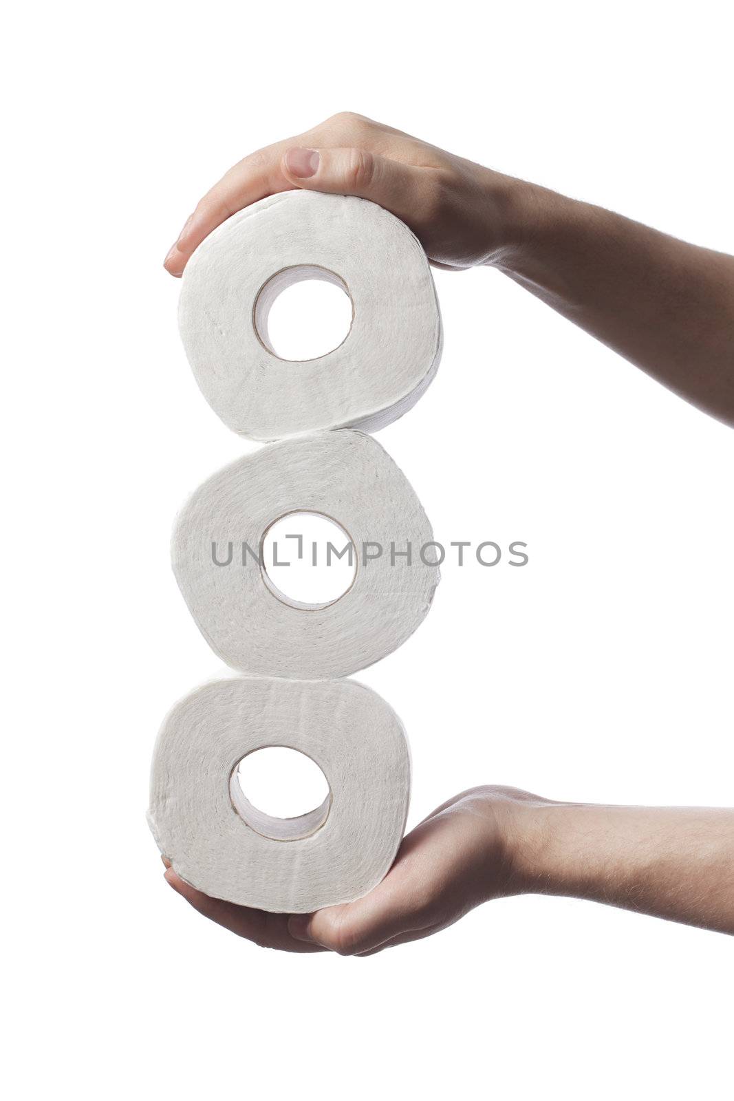 Man holding three rolls of white toilet paper in his hands.