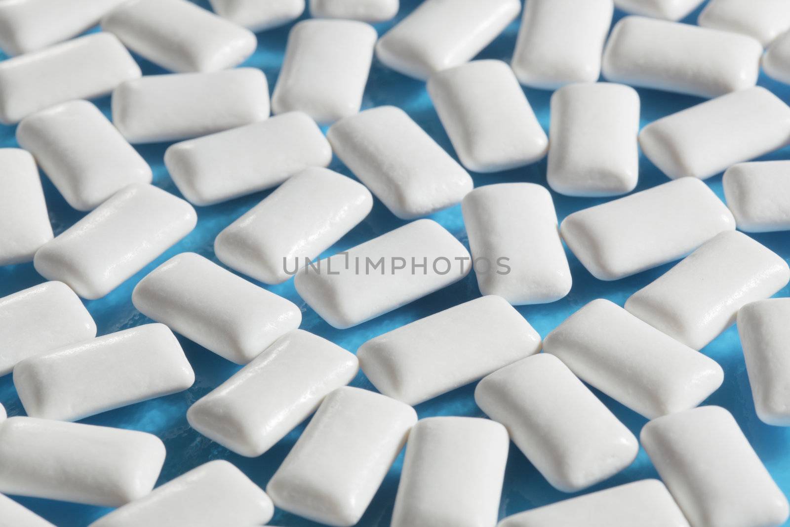 White rectangular Chewing gums on blue