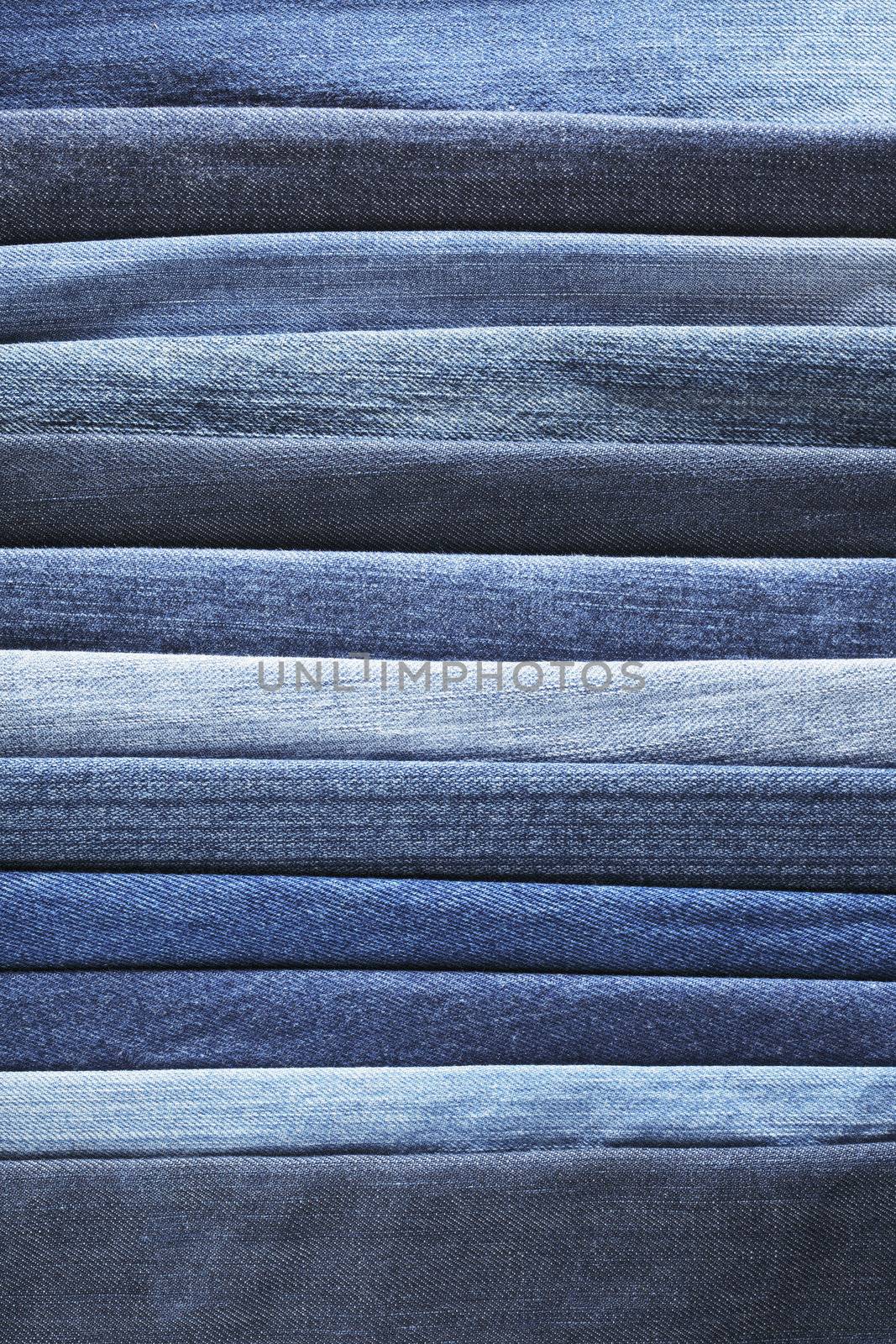 Different shades of blue jeans denim fabrics.