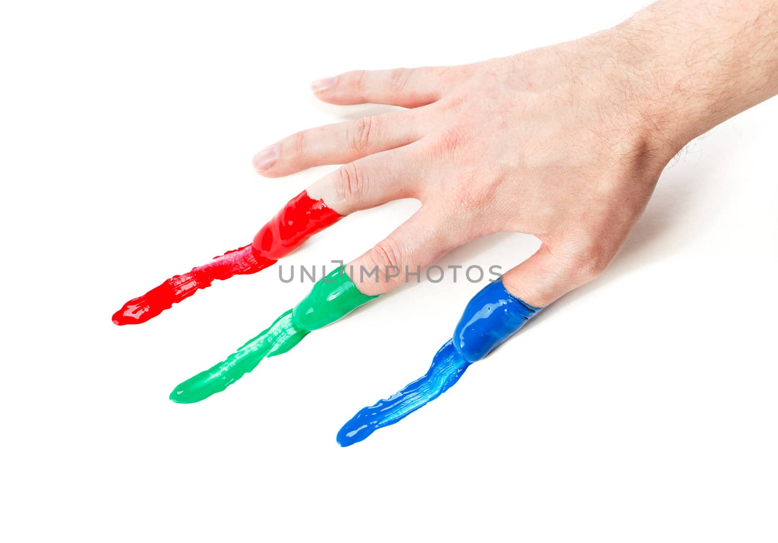 Fingers with fingerpaints in three primary colors, Red, green and blue.