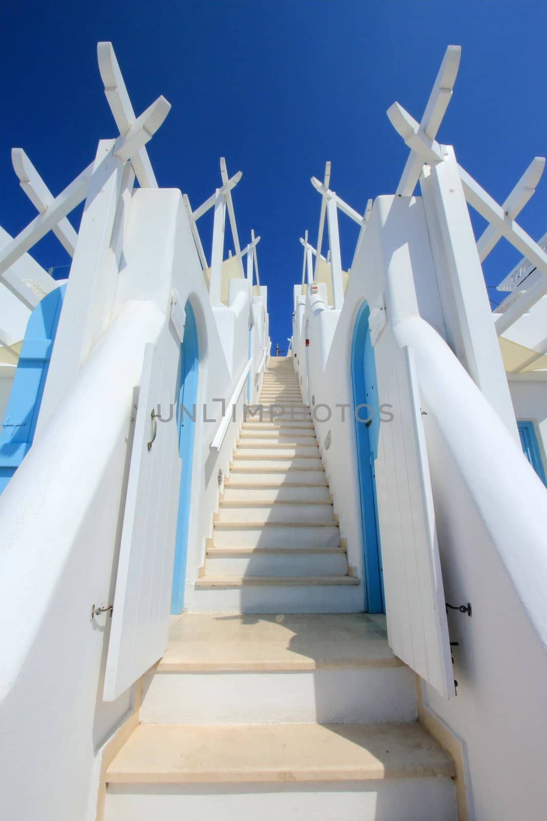 Beautiful colorful stairs with two walls going to the blue sky