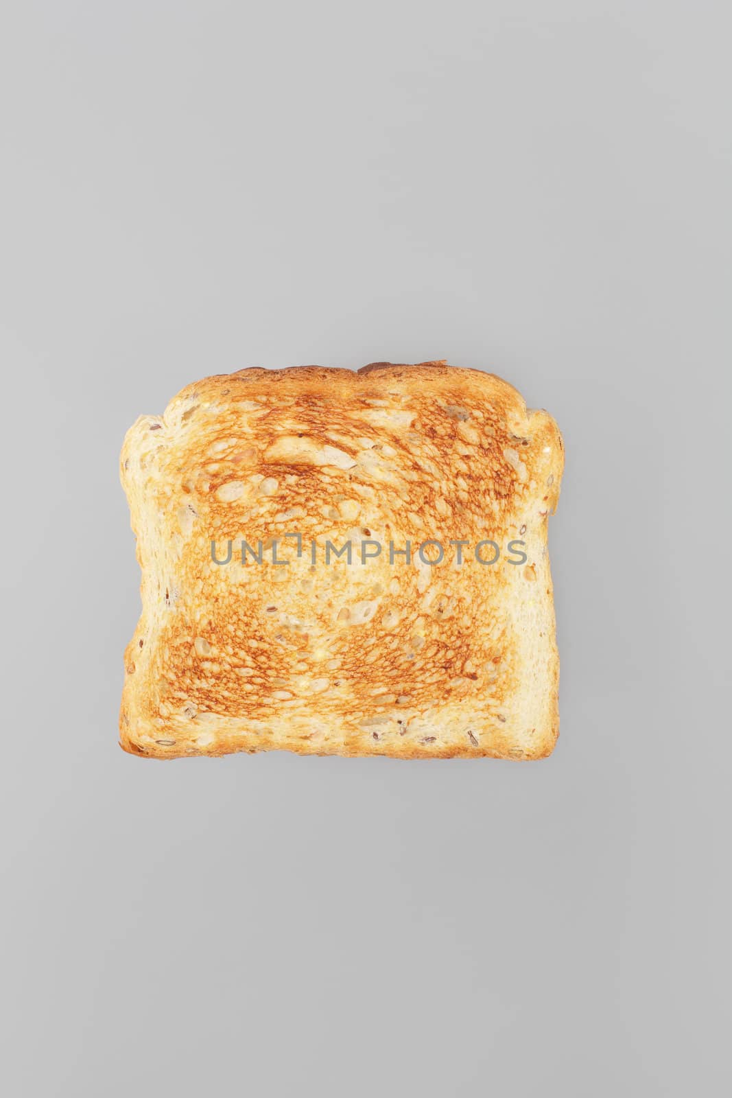 A Slice of toast bread on grey background