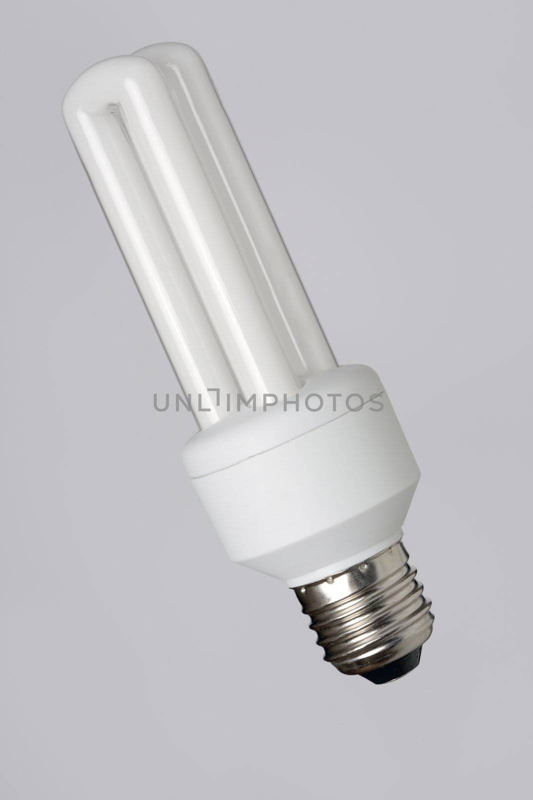 Energy saving fcompact fluorescent bulb on grey