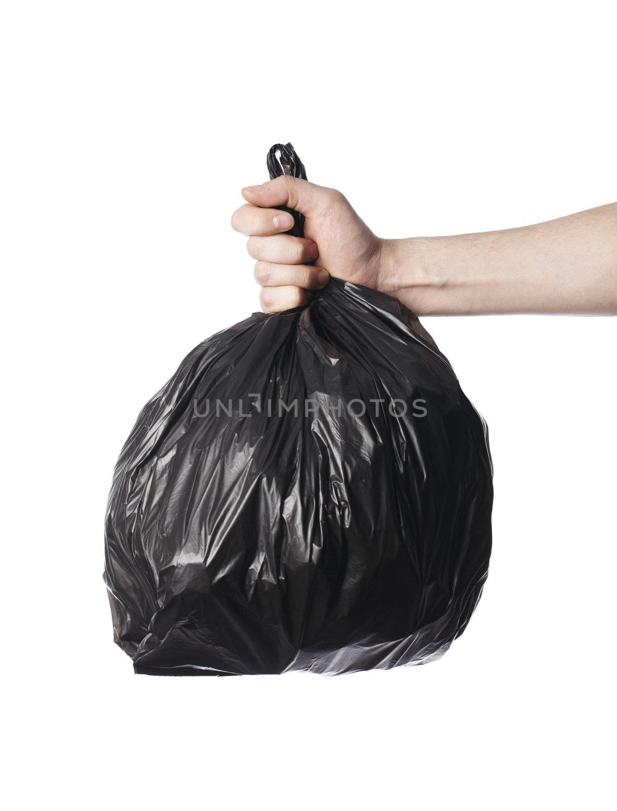 Man holding a full black plastic trash bag in his hand.