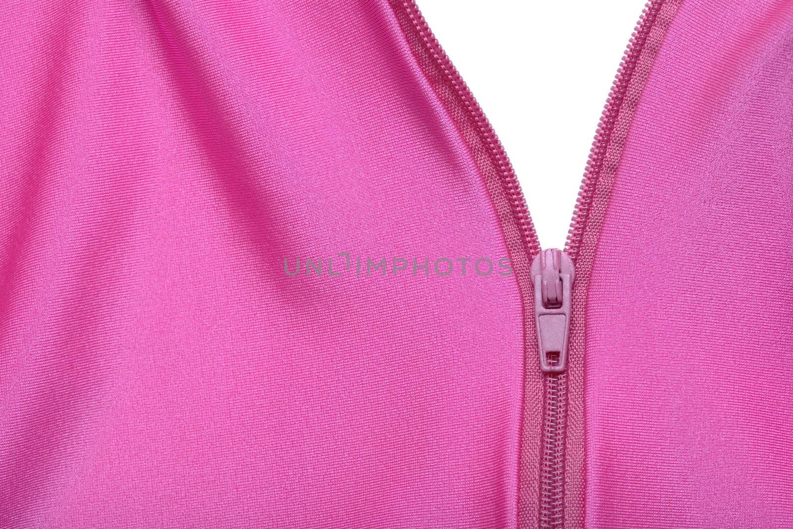 Zipper of a fuchsia colored garment revealing a white surface
