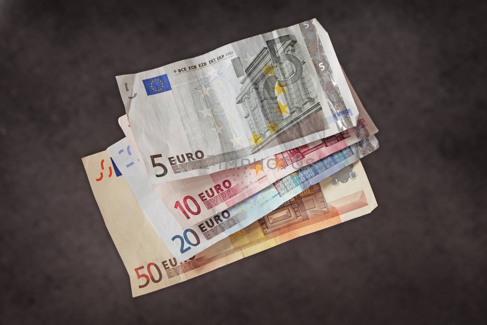 Hard earned money: wrinkled euro bills