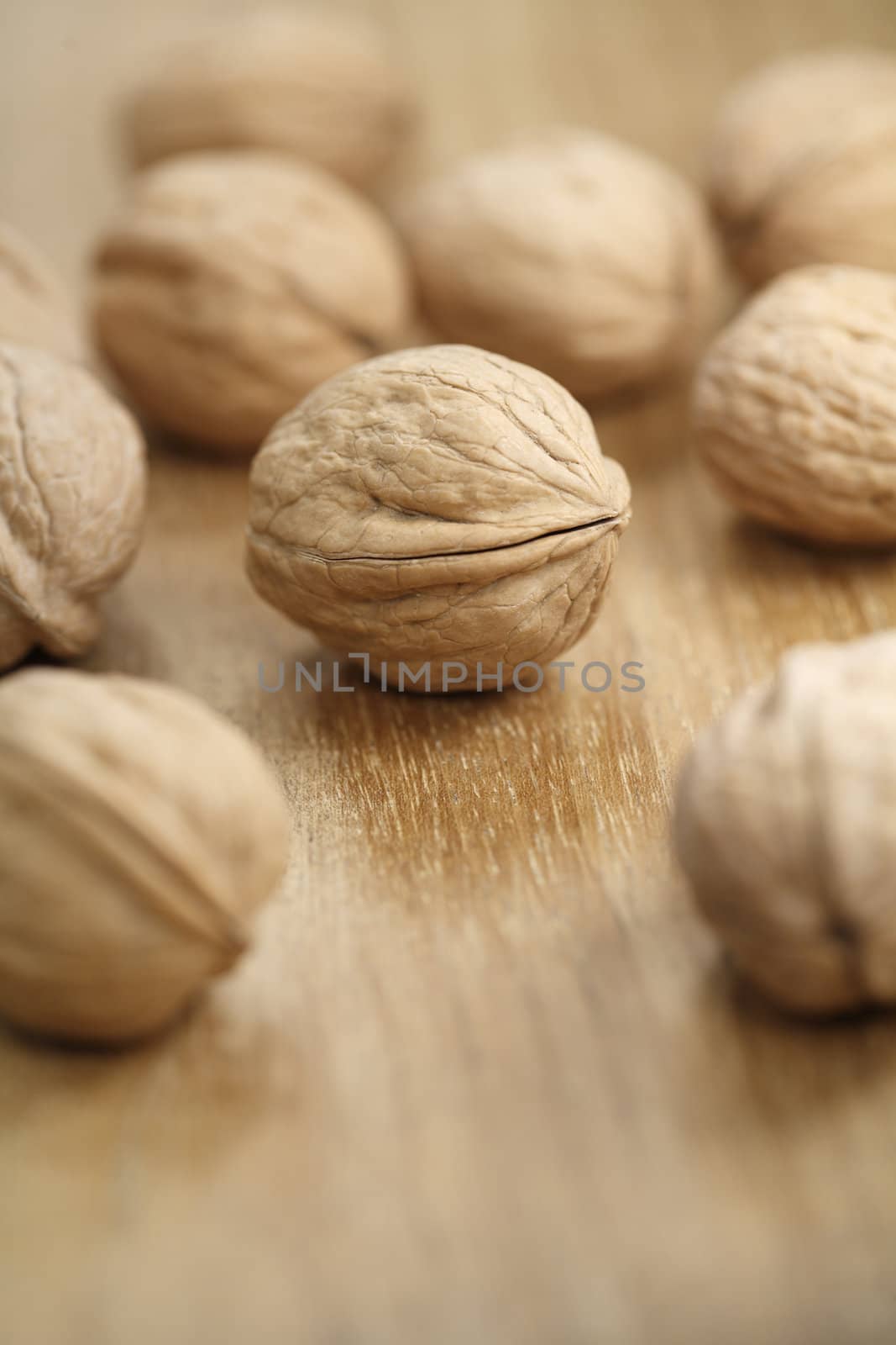 Whole walnuts on a wooden table