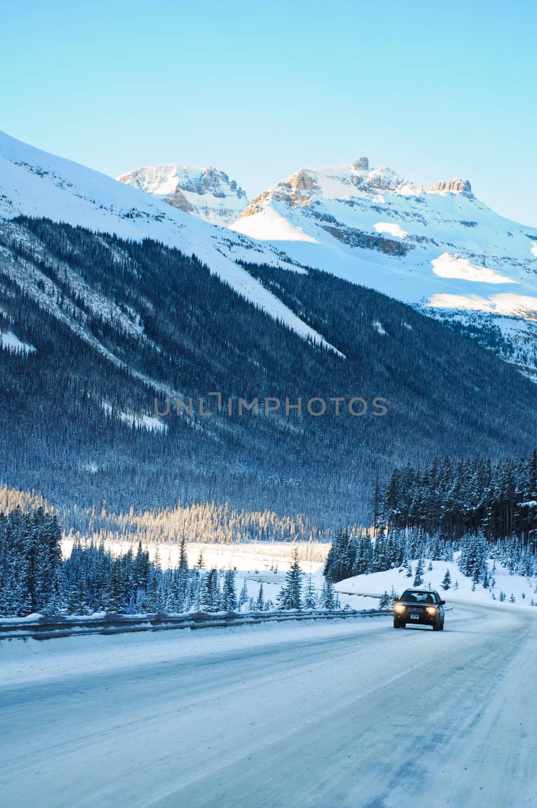 Highway in Winter through mountains little traffic