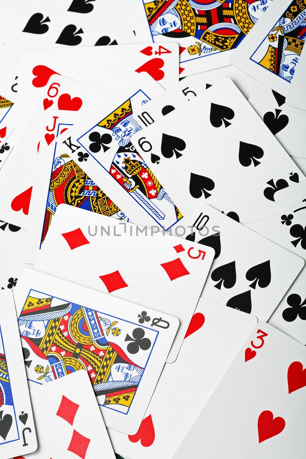 new, un-used playing cards in a random arrangement