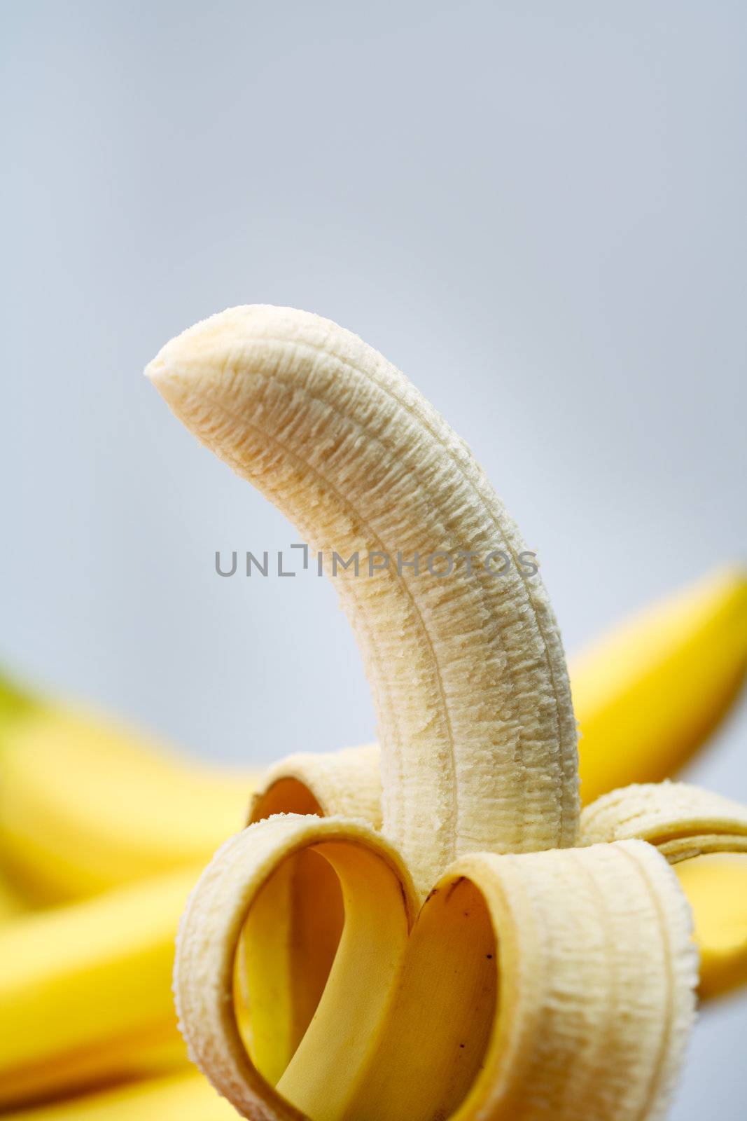 A Peeled banana, ready to eat.