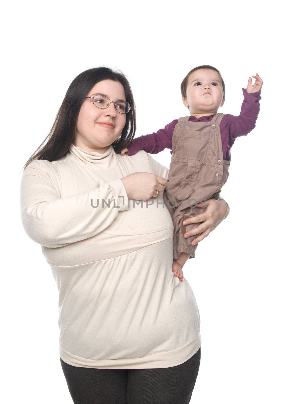 Woman holding her little daughter on hands