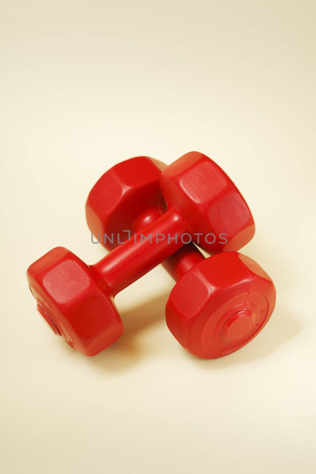 Red dumbells by Stocksnapper