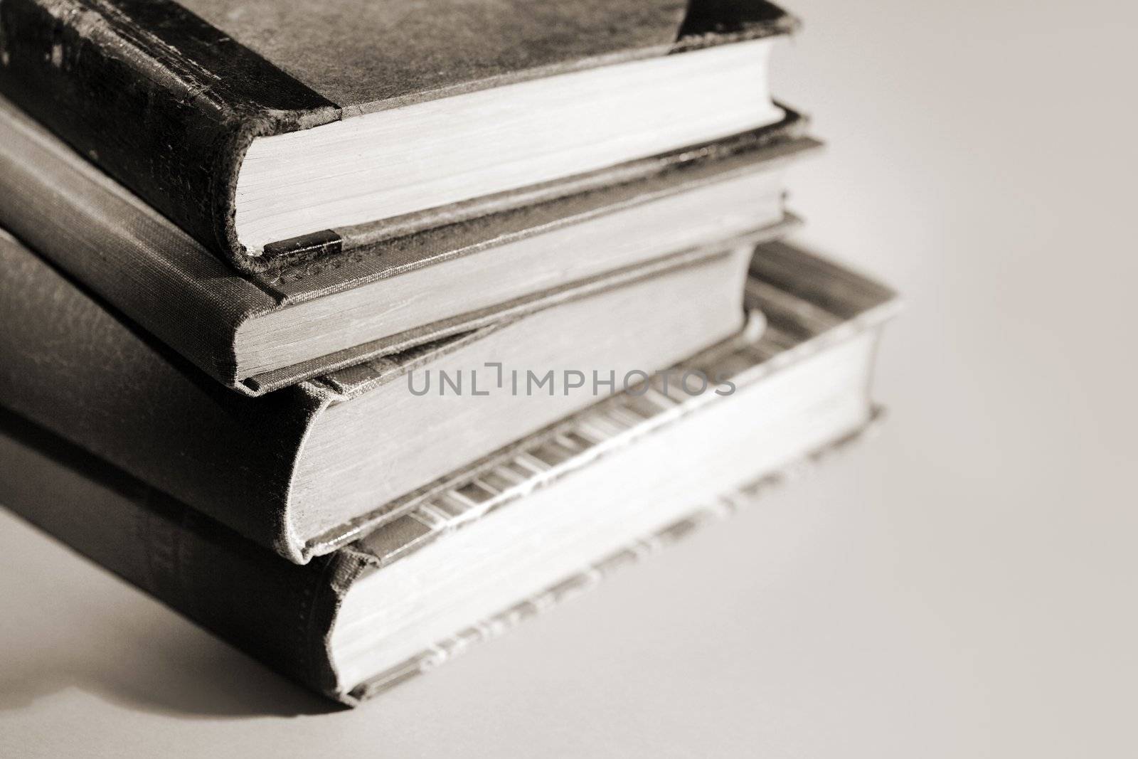 Monochromatic image of stacked old books
