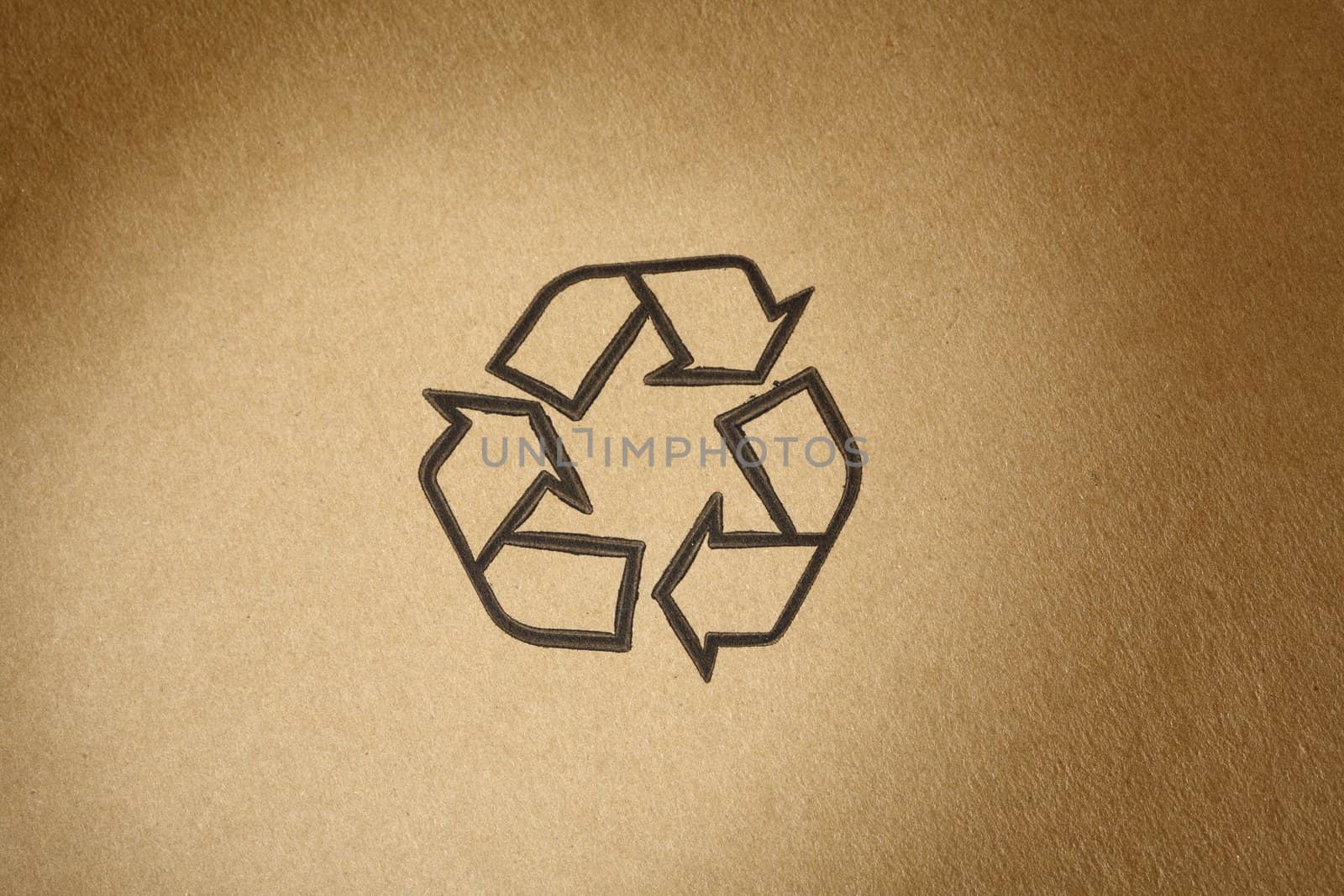 "Recyclable" universal symbol, printed on brown cardboard