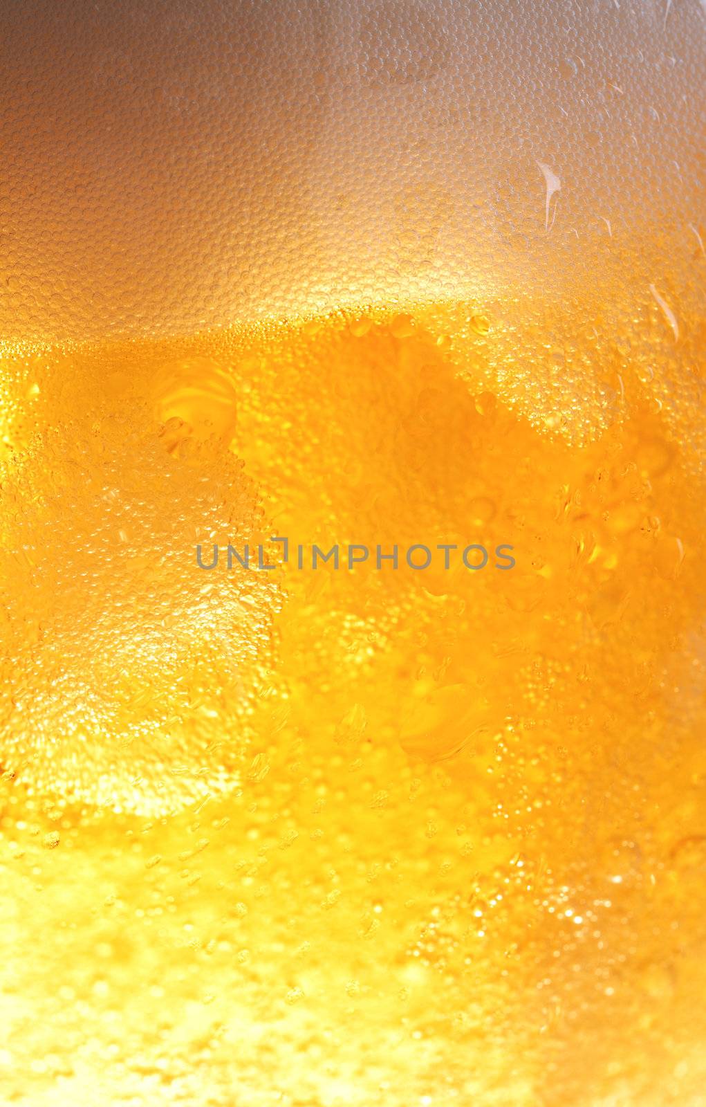 Bubbles in beer and droplets outside the glass.