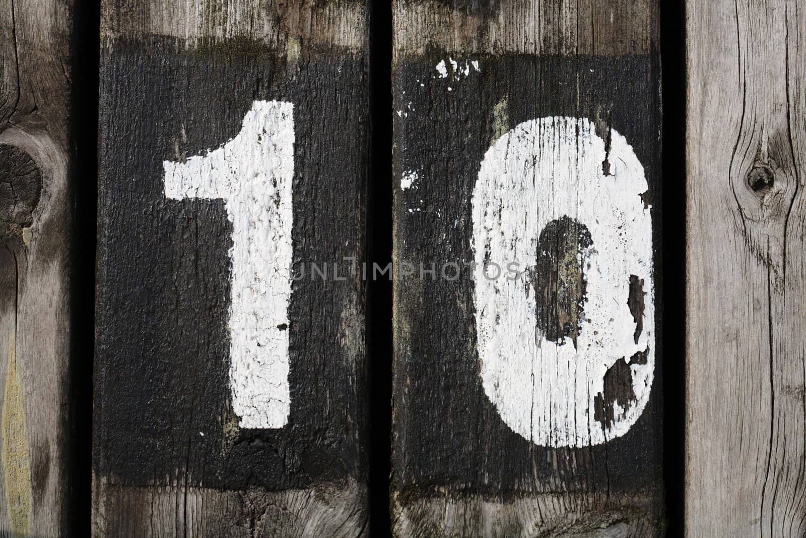 Number 10 painted on wood