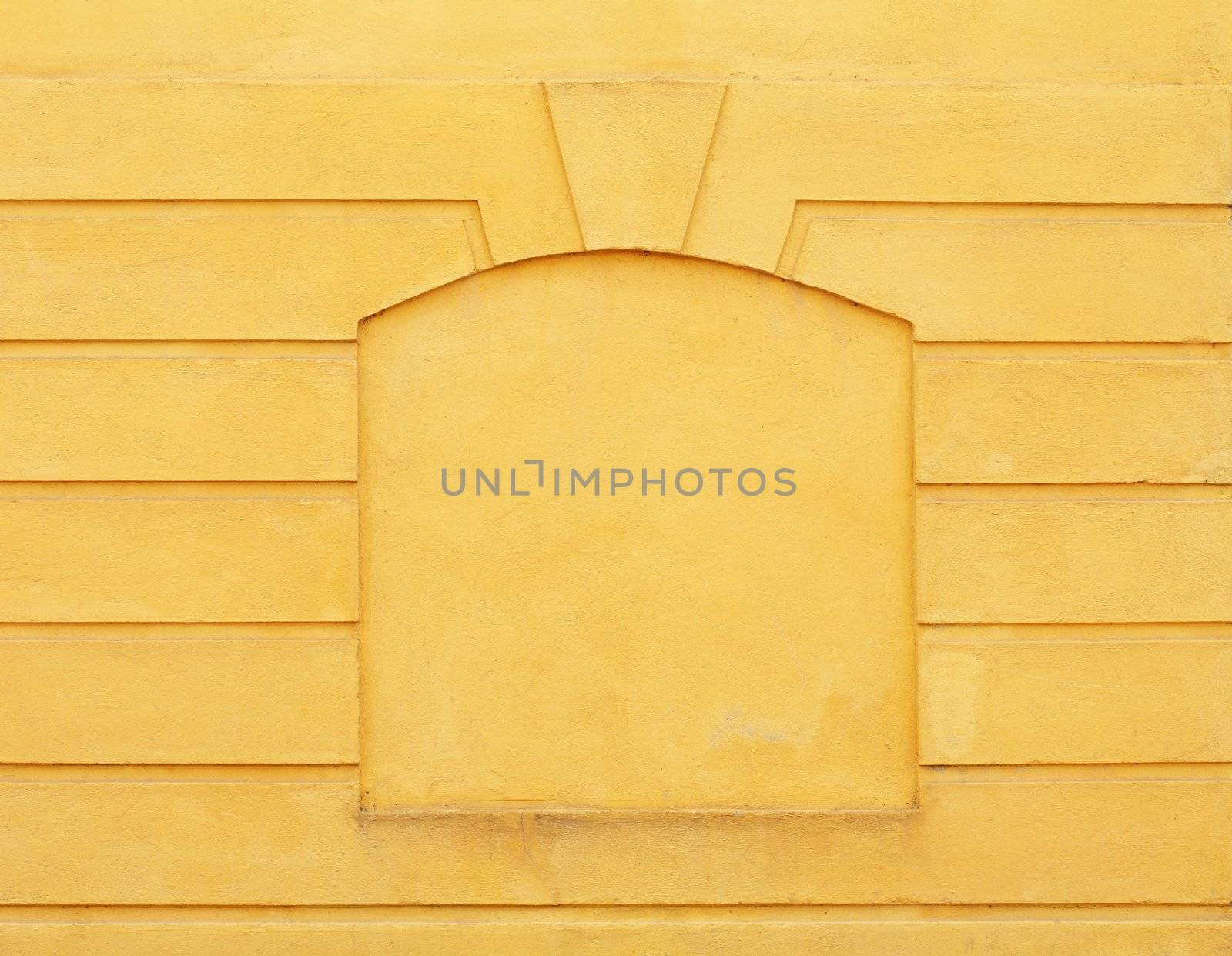 Yellow concrete wall with a "frame"