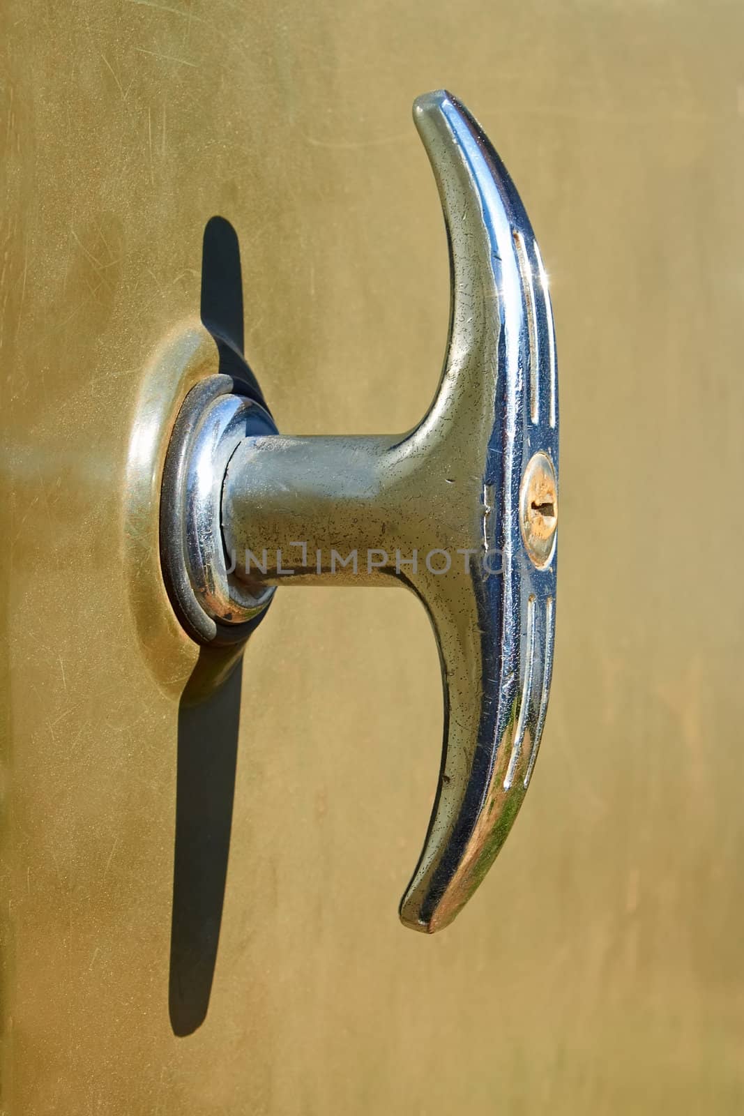 Old nickel-plated doors handle with integrated lock