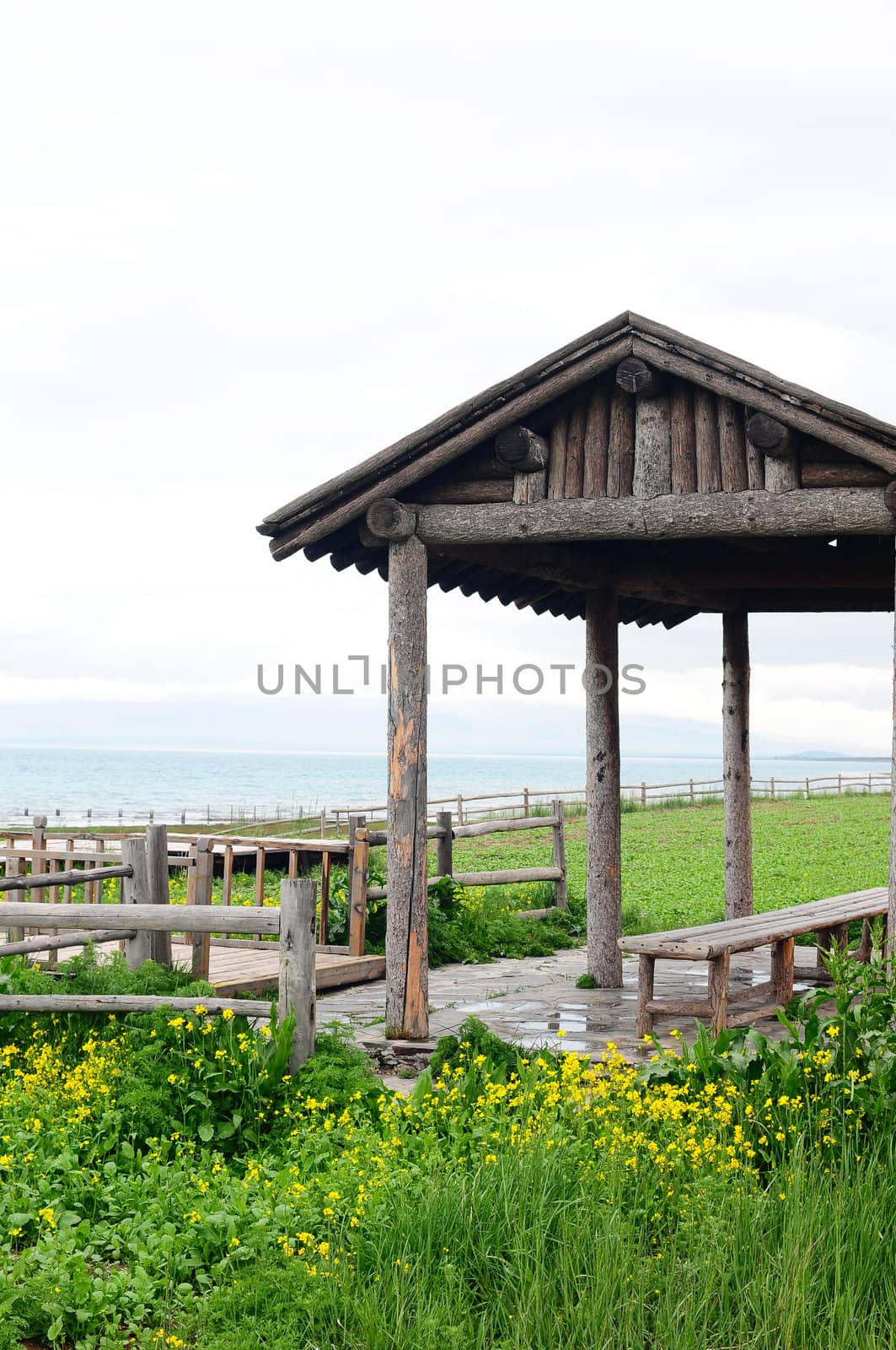 Landscape of wooden pavilion and fence in the grassland
