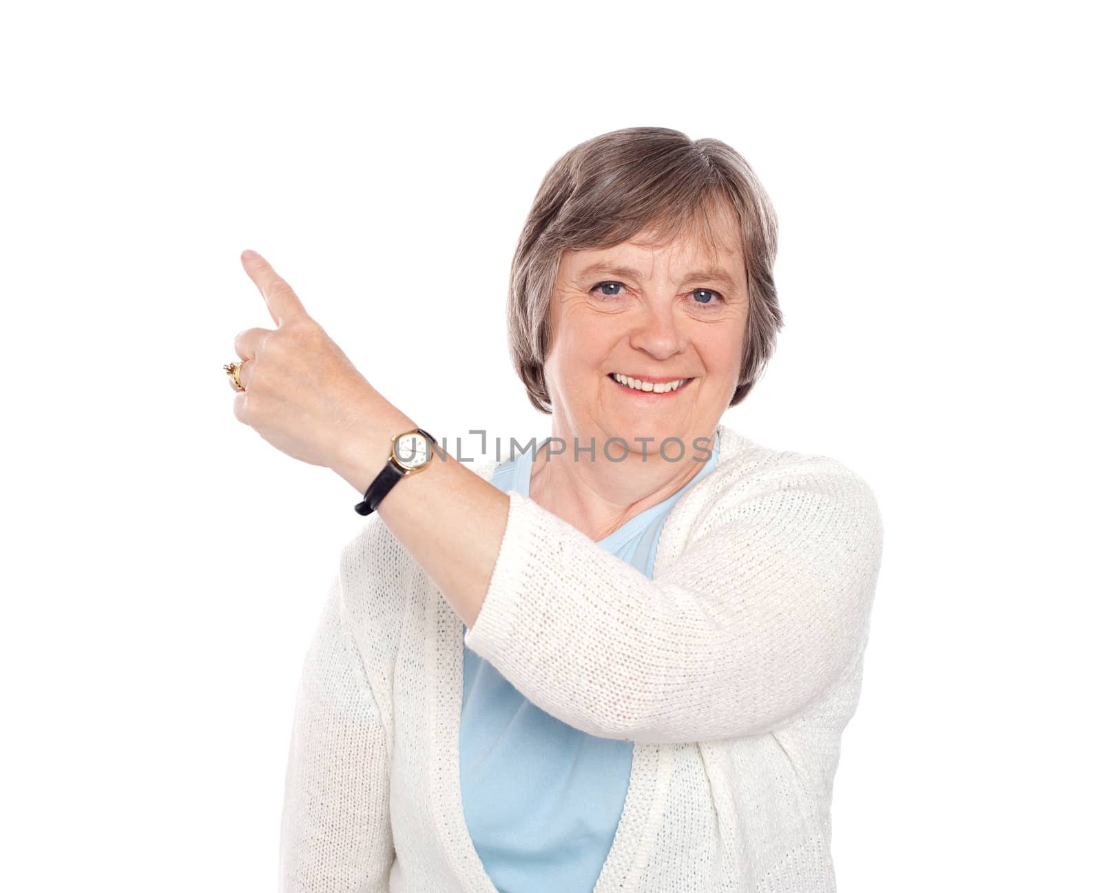 Beautiful senior woman indicating copy space. All on white background