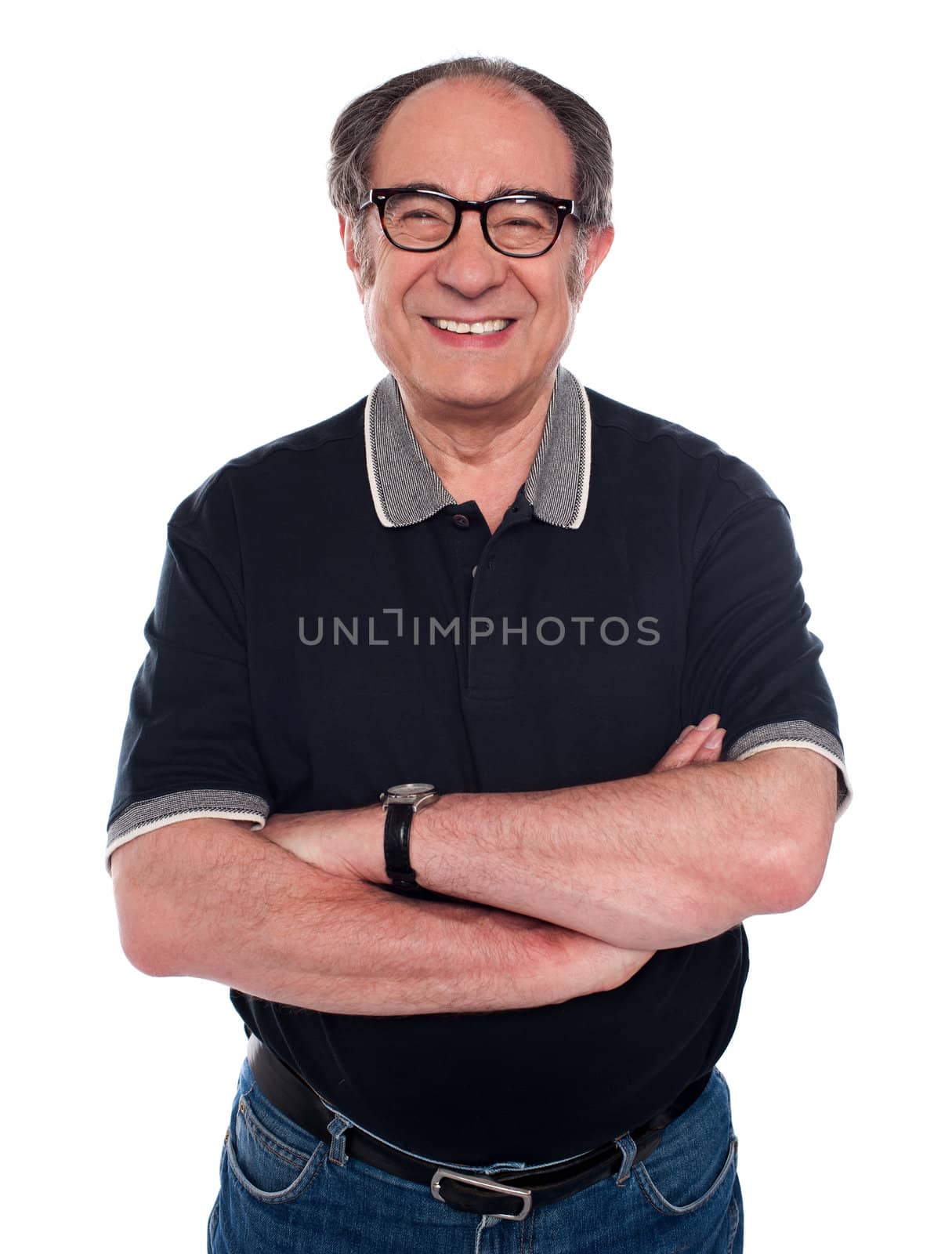 Cheerful old man standing with arms crossed against white background
