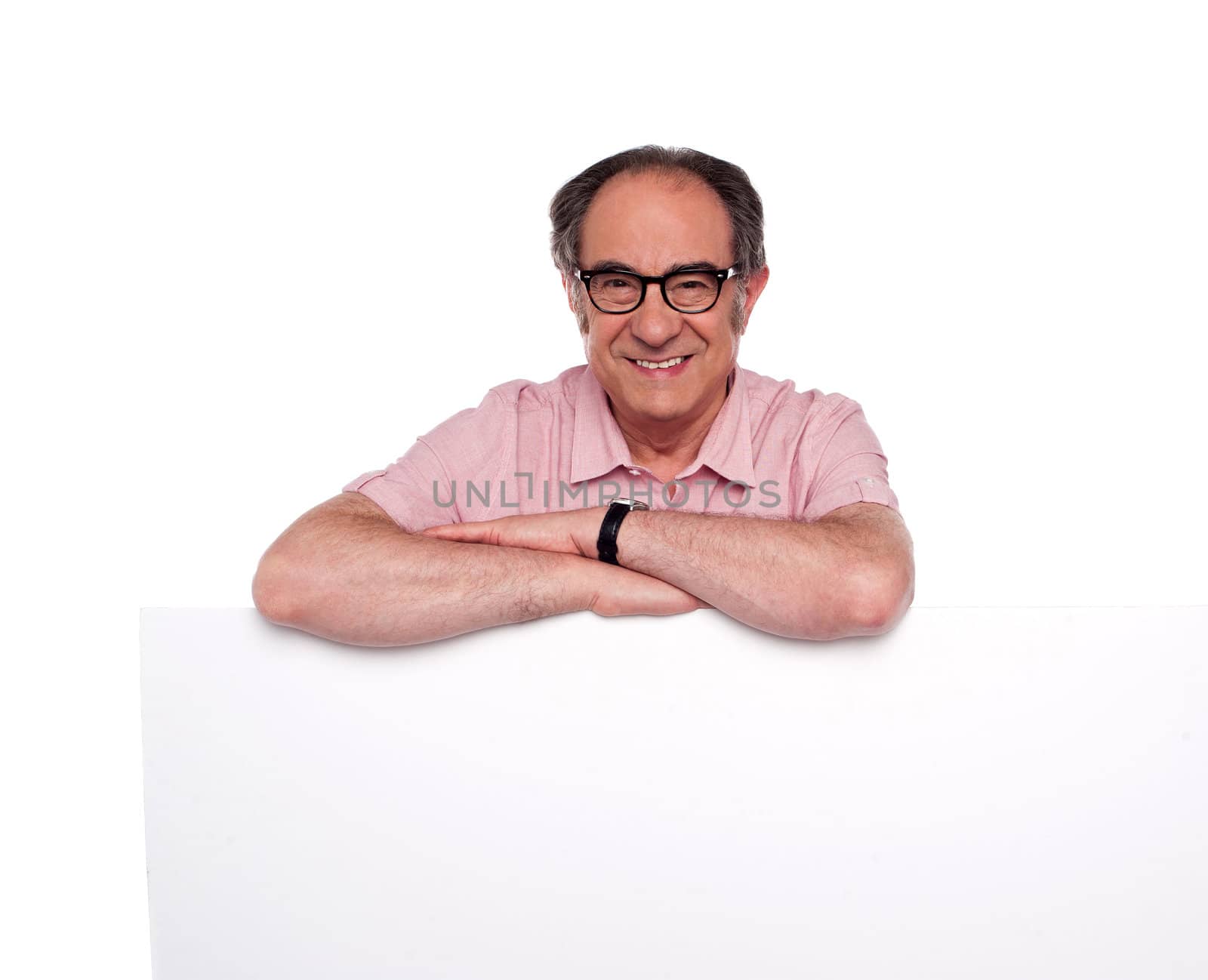 Matured man standing behind blank placard. Isolated over white background