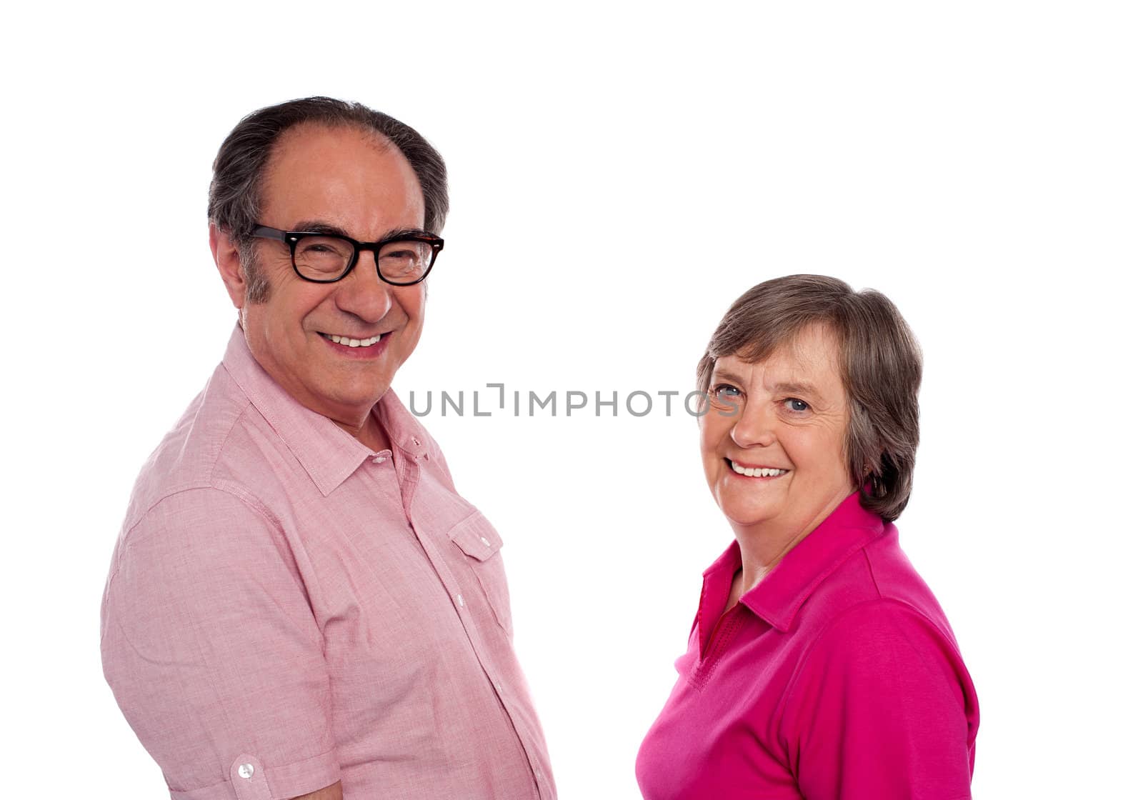 Senior couple. Love birds posing against white background