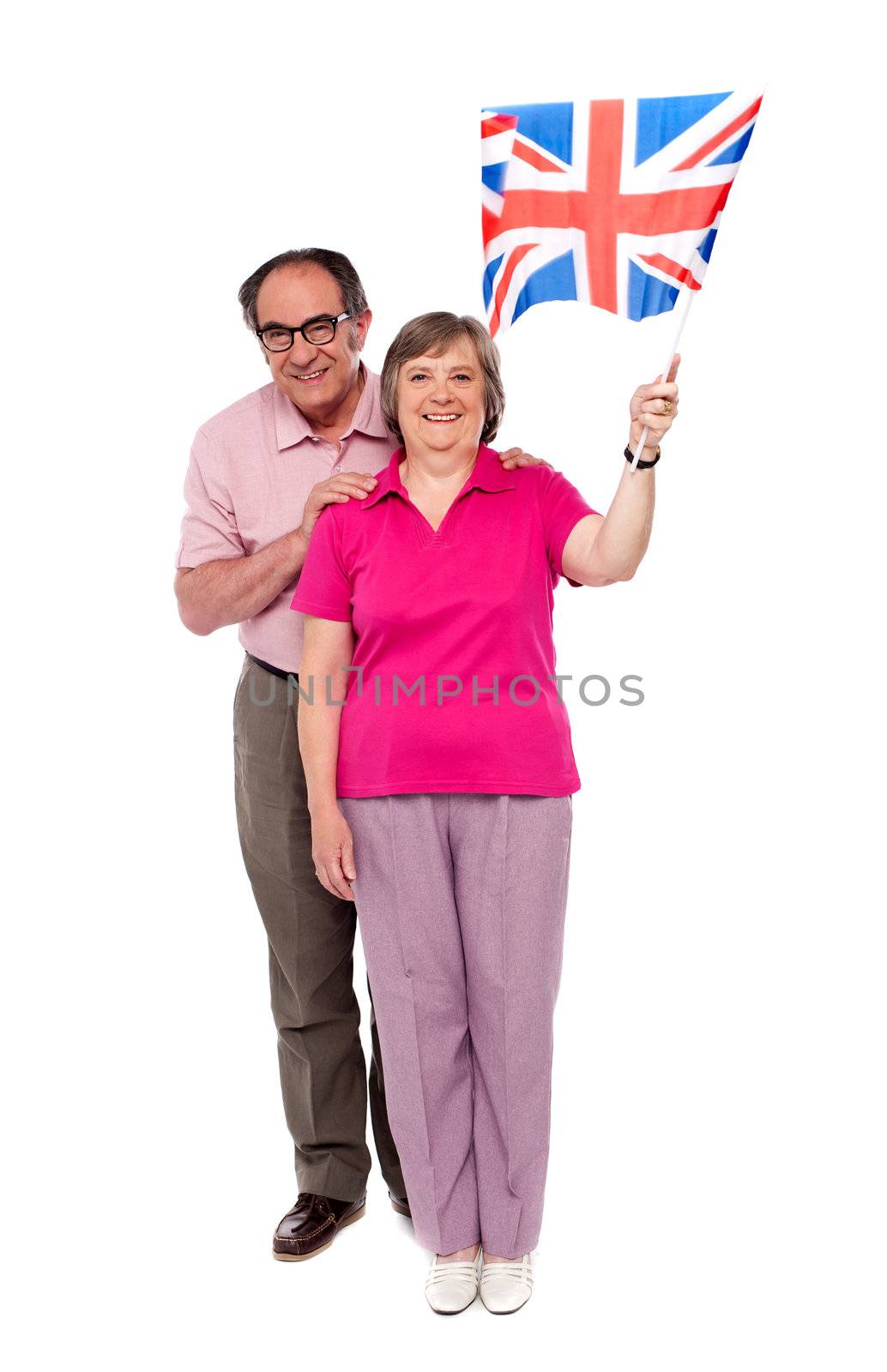 Old couple waving UK flag. Supporting nation and cheering