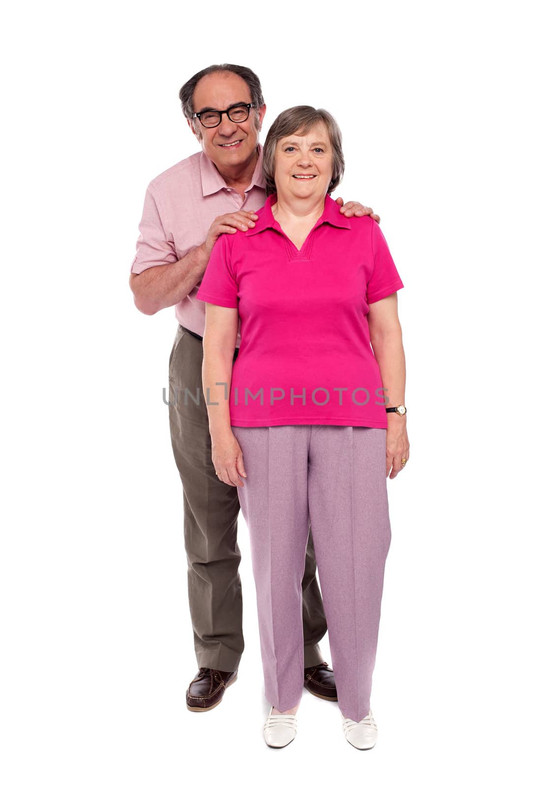Full length portrait of an aged love couple by stockyimages