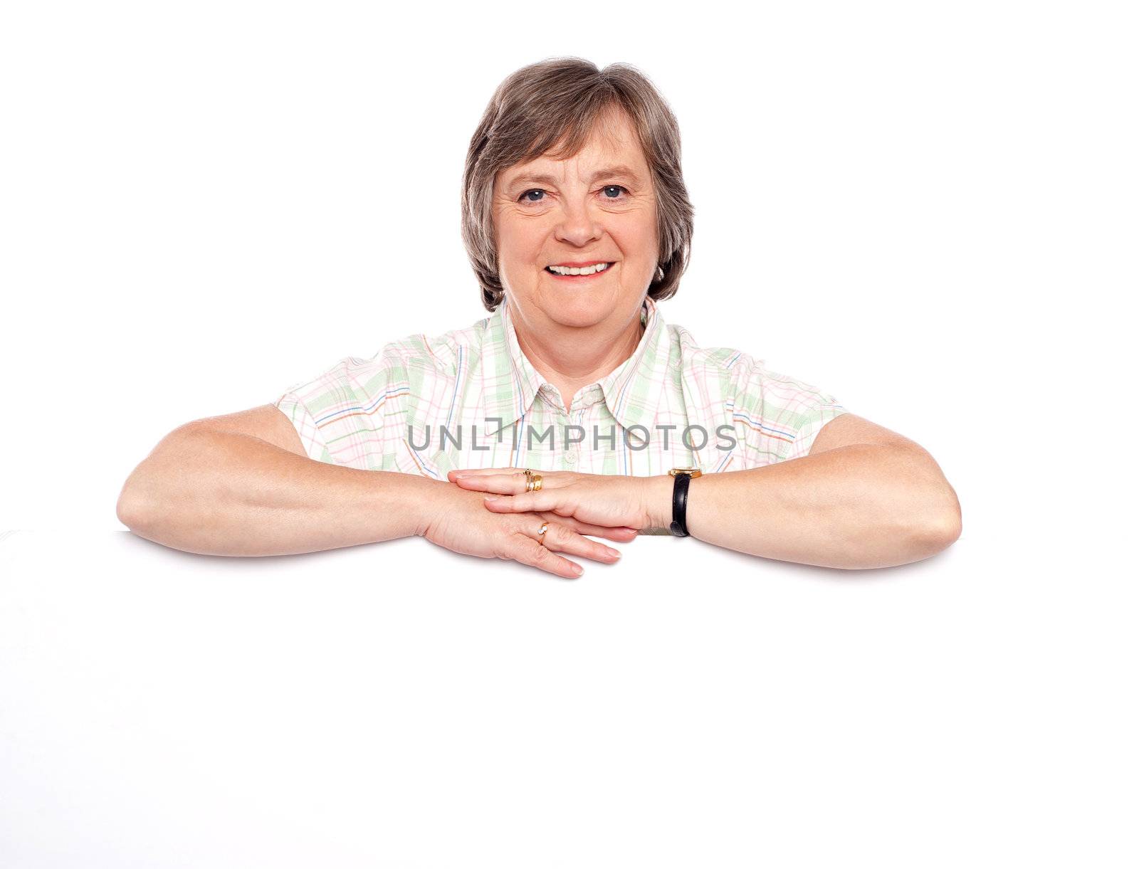 Aged woman standing behind blank billboard. All on white background