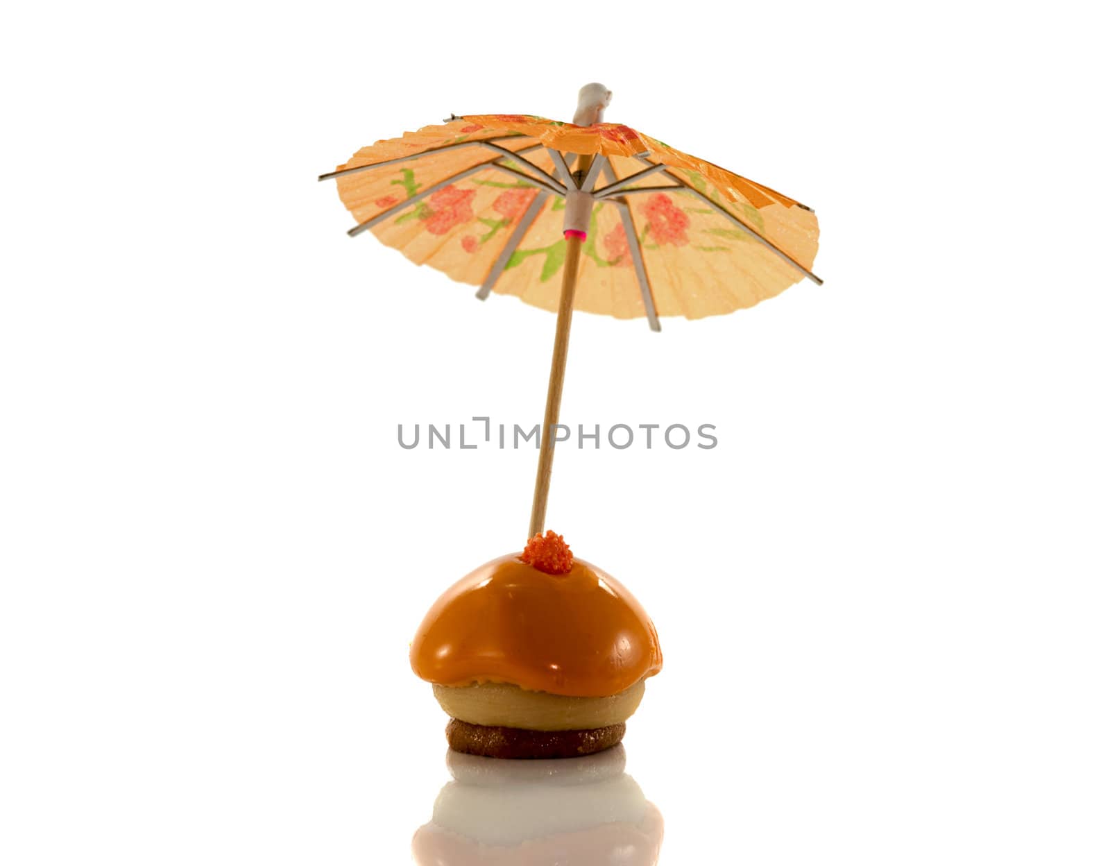 orange dutch pastry with umbrella isolated on white