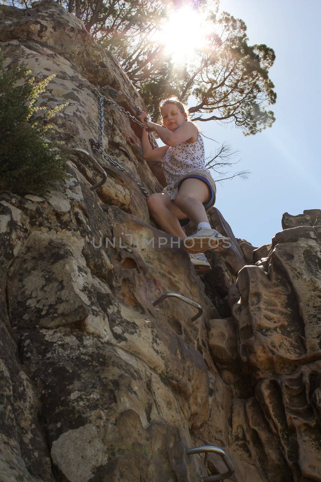 Woman Climbing Up Lions Head by dwaschnig_photo