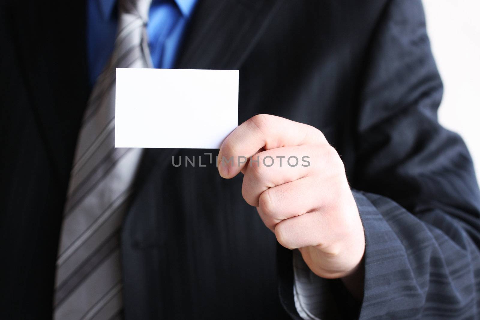 Successful businessman holding empty card  by photochecker