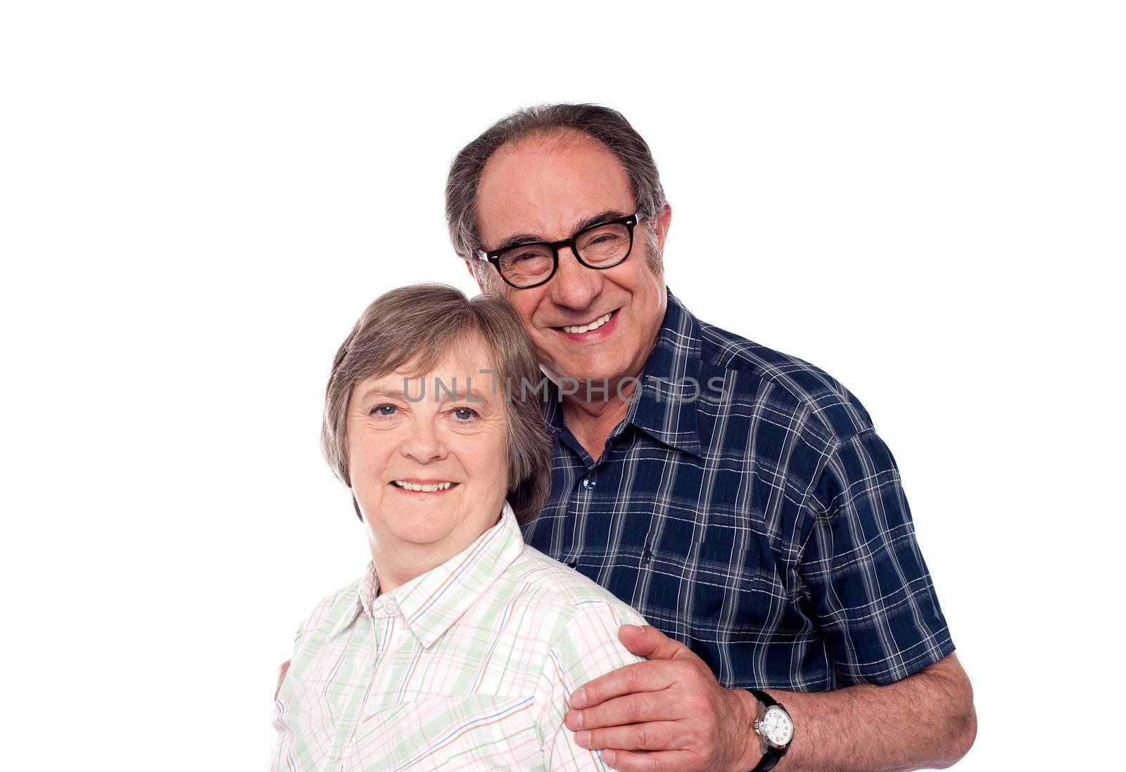 Matured couple posing with smile looking at camera