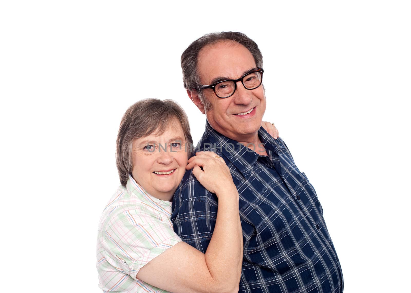 Closeup portrait of cheerful senior couple by stockyimages