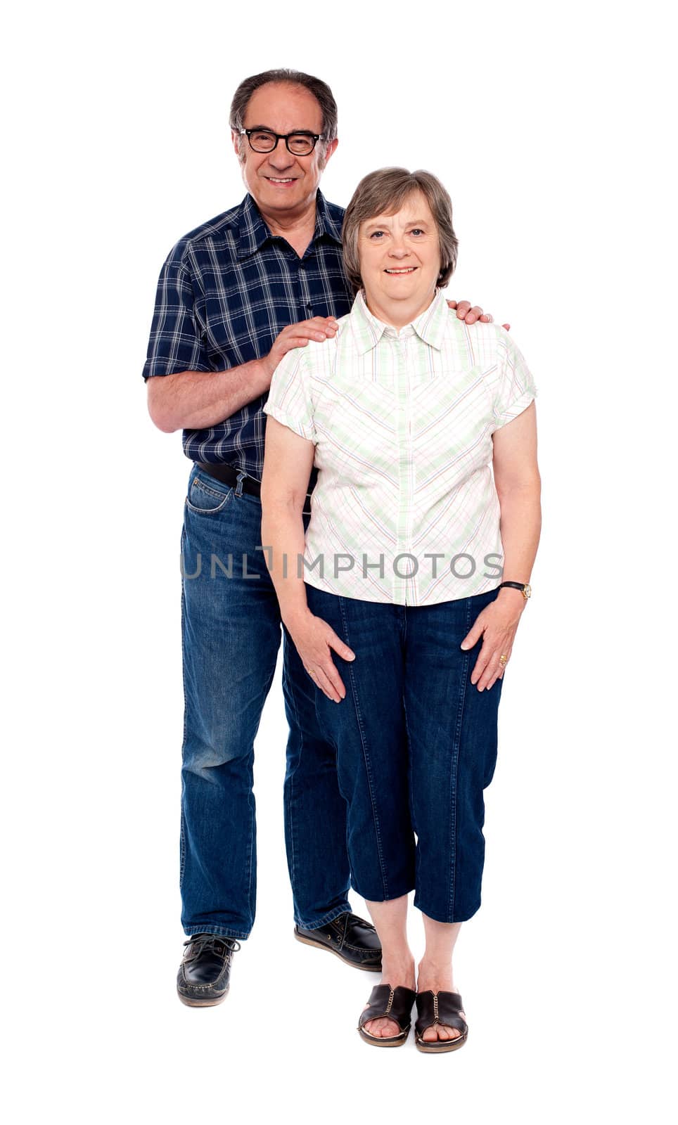 Full length portrait of attractive aged couple isolated over white background